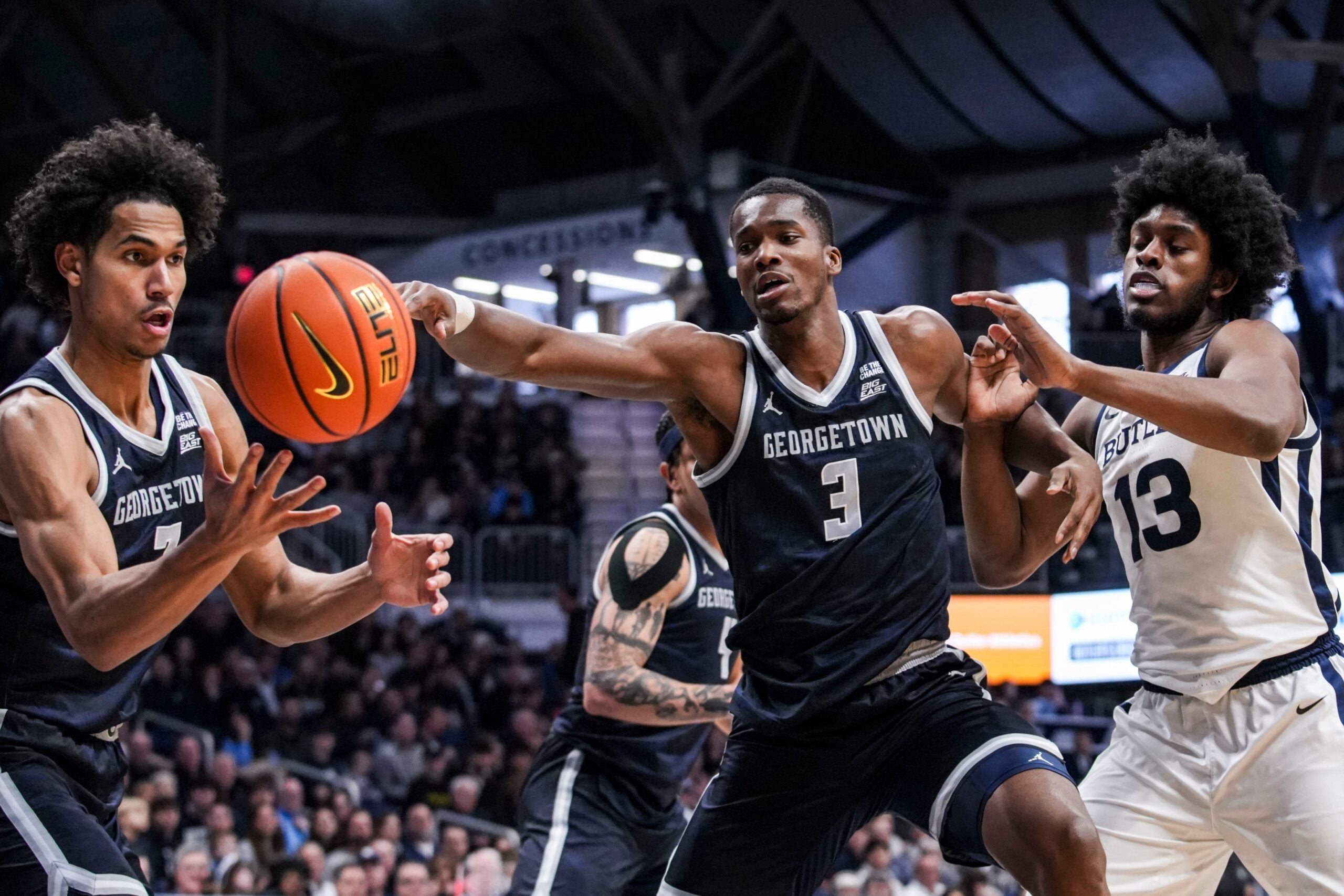Georgetown Hoyas forward Isaiah Abraham (7), Georgetown Hoyas center Vincent Iwuchukwu (3) and Butler Bulldogs center Drayton Jones (13) reach for the ball Saturday, Jan. 31, 2026, during a basketball game between the Butler Bulldogs and the Georgetown Hoyas at Hinkle Fieldhouse in Indianapolis.