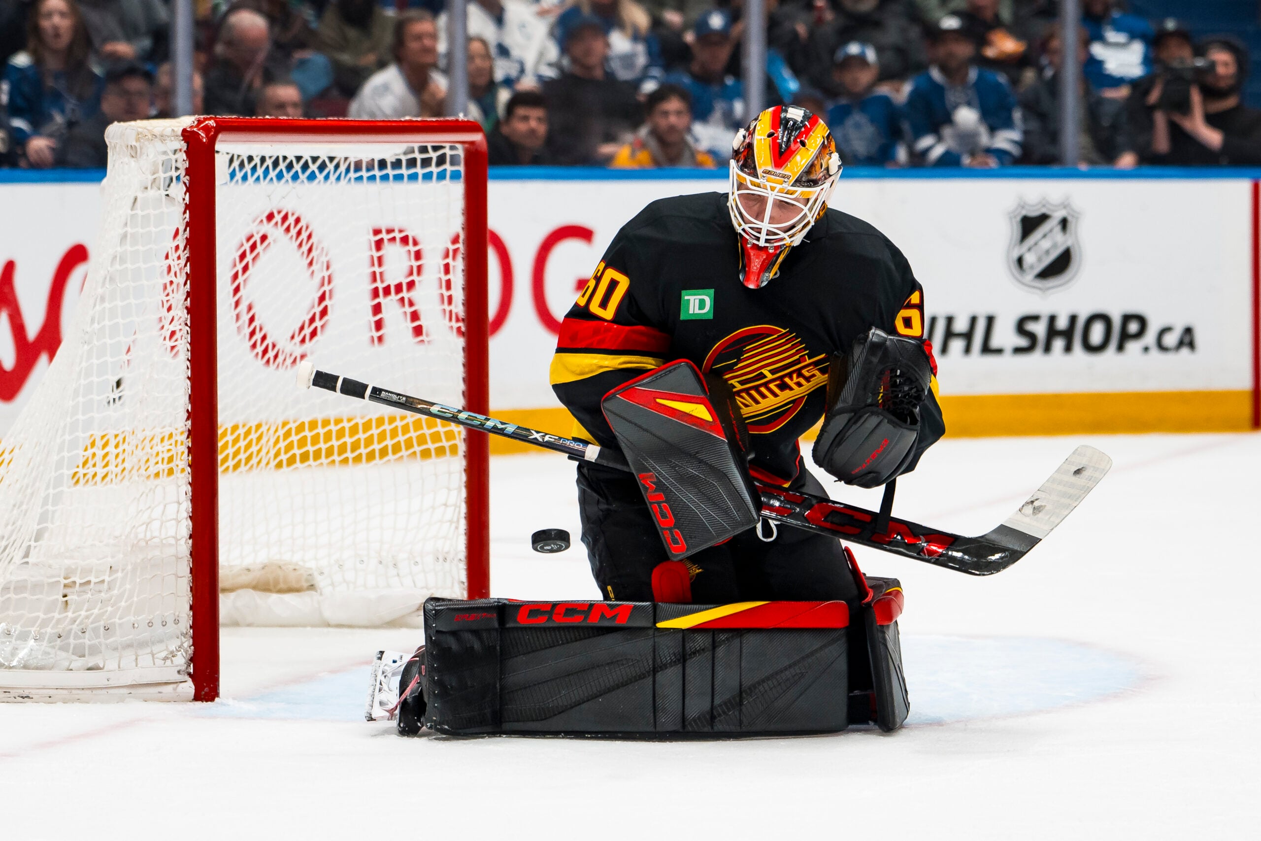 Jan 31, 2026; Vancouver, British Columbia, CAN; Vancouver Canucks goalie Nikita Tolopilo (60) makes a save against the Toronto Maple Leafs in the third period at Rogers Arena. Mandatory Credit: Bob Frid-Imagn Images