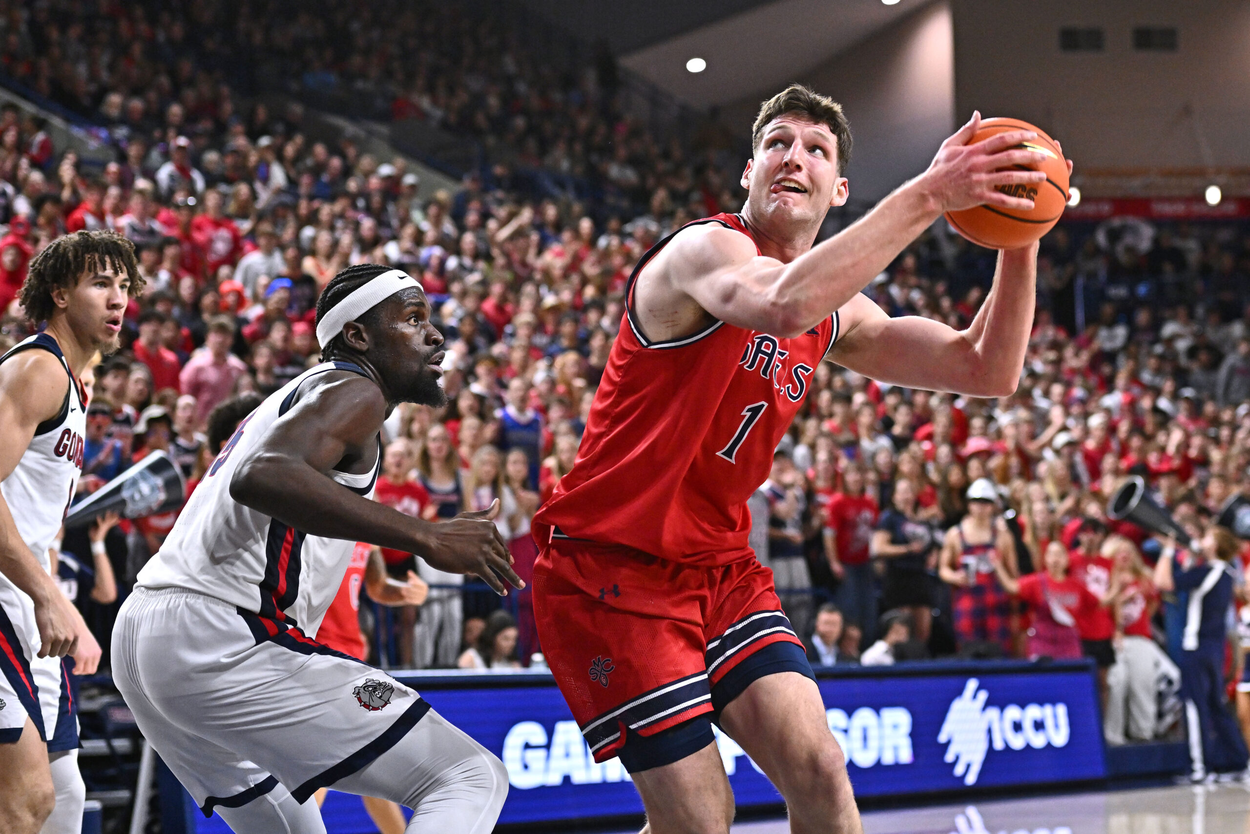 Jan 31, 2026; Spokane, Washington, USA; Saint Mary's Gaels center Harry Wessels (1) shoots the ball against Gonzaga Bulldogs forward Graham Ike (15) in the second half at McCarthey Athletic Center. Gonzaga Bulldogs won 73-65. Mandatory Credit: James Snook-Imagn Images