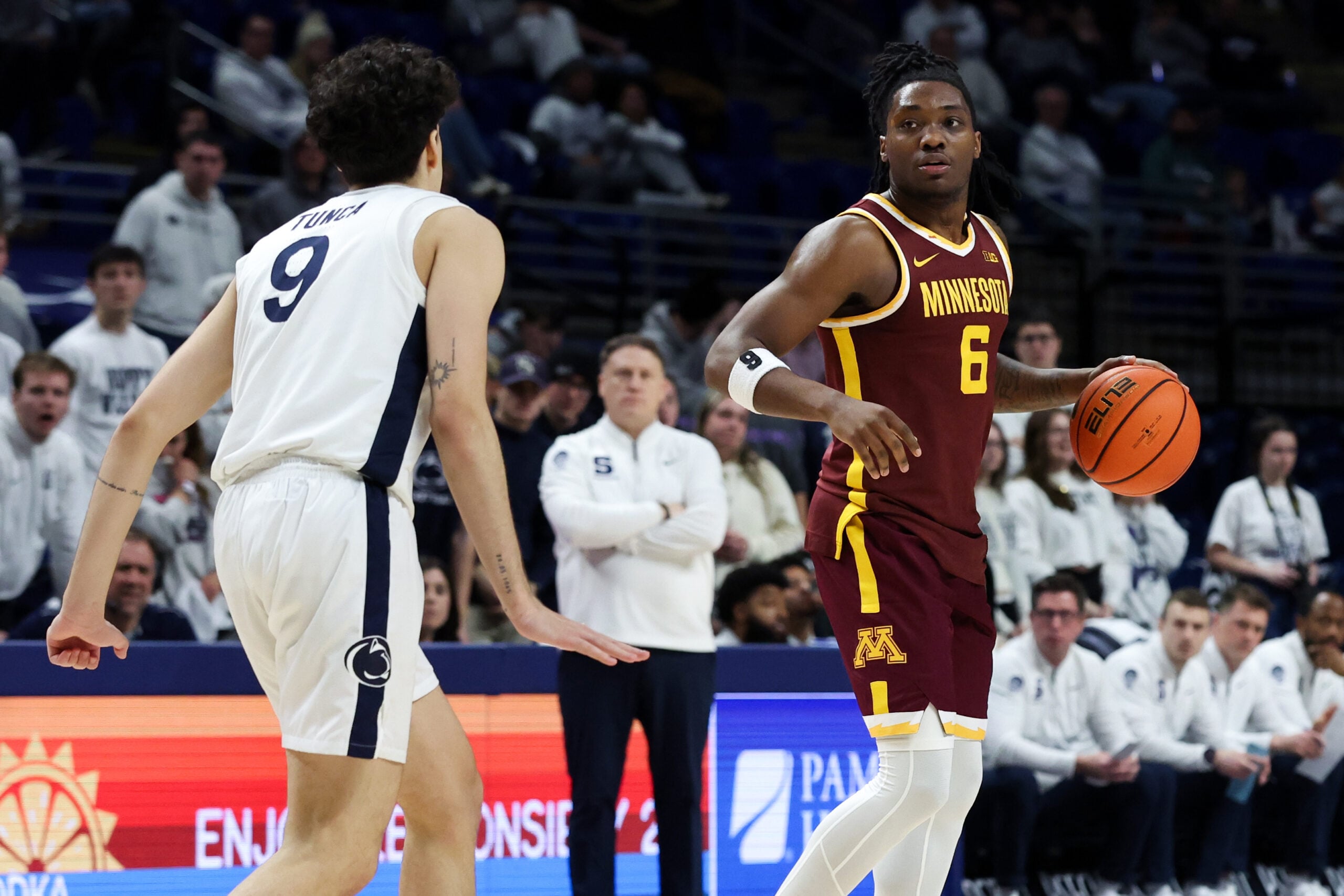 Feb 1, 2026; University Park, Pennsylvania, USA; Minnesota Golden Gophers guard Langston Reynolds (6) dribbles the ball as Penn State Nittany Lions guard Melih Tunca (9) defends during the second half at Bryce Jordan Center. Mandatory Credit: Matthew O'Haren-Imagn Images