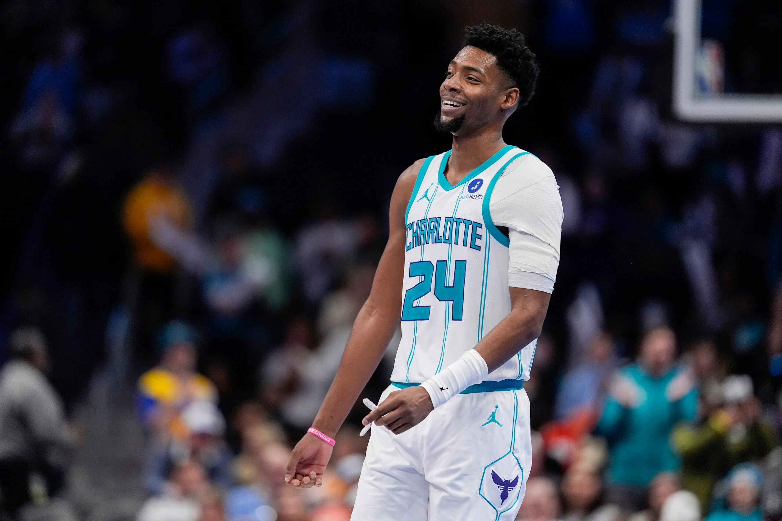Feb 2, 2026; Charlotte, North Carolina, USA;  Charlotte Hornets forward Brandon Miller (24) smiles in the final seconds of the come from behind win against the New Orleans Pelicans during the second half at the Spectrum Center. Mandatory Credit: Jim Dedmon-Imagn Images