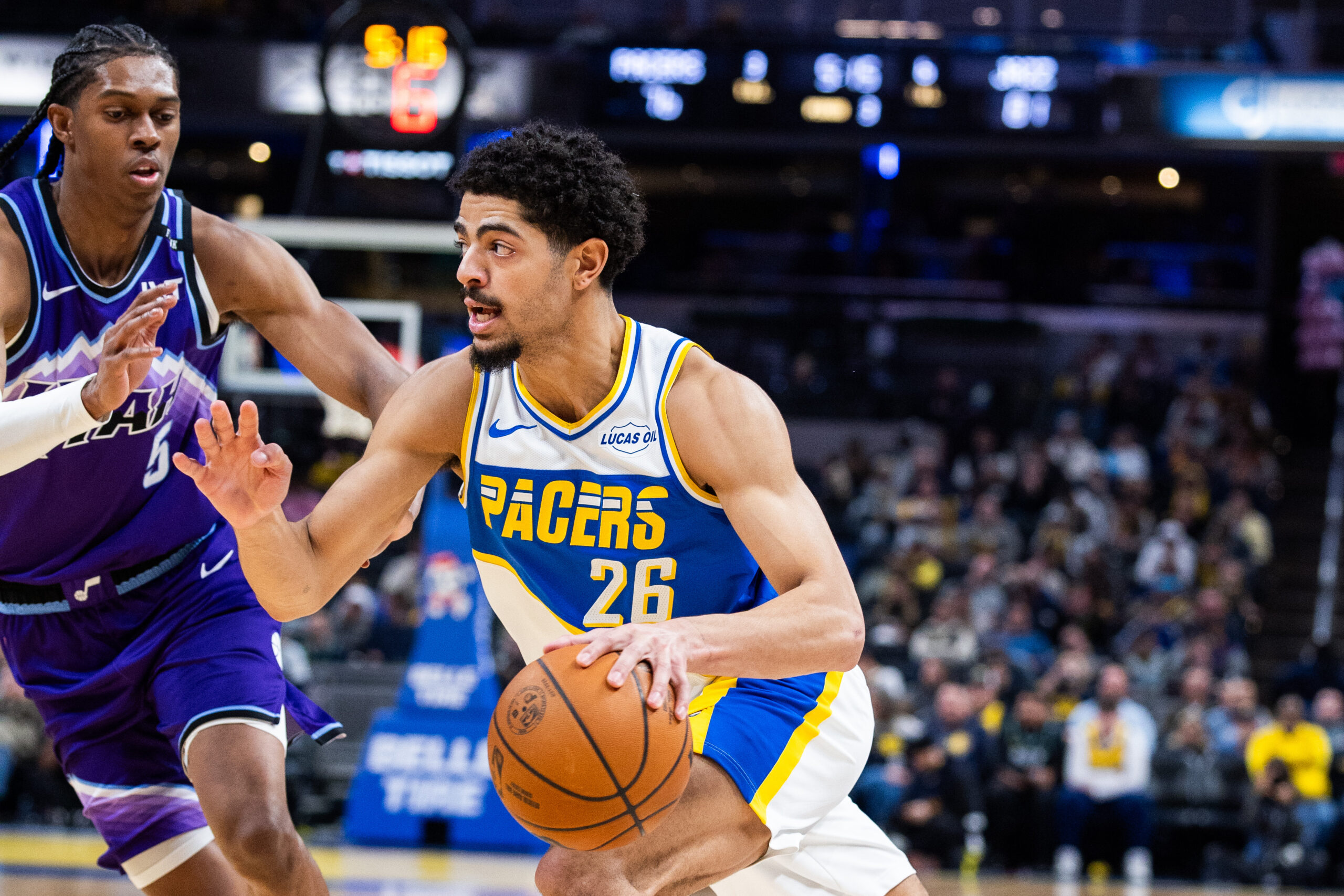 Feb 3, 2026; Indianapolis, Indiana, USA; Indiana Pacers guard Ben Sheppard (26) dribbles the ball while Utah Jazz guard Isaiah Collier (8) defends in the second half at Gainbridge Fieldhouse. Mandatory Credit: Trevor Ruszkowski-Imagn Images