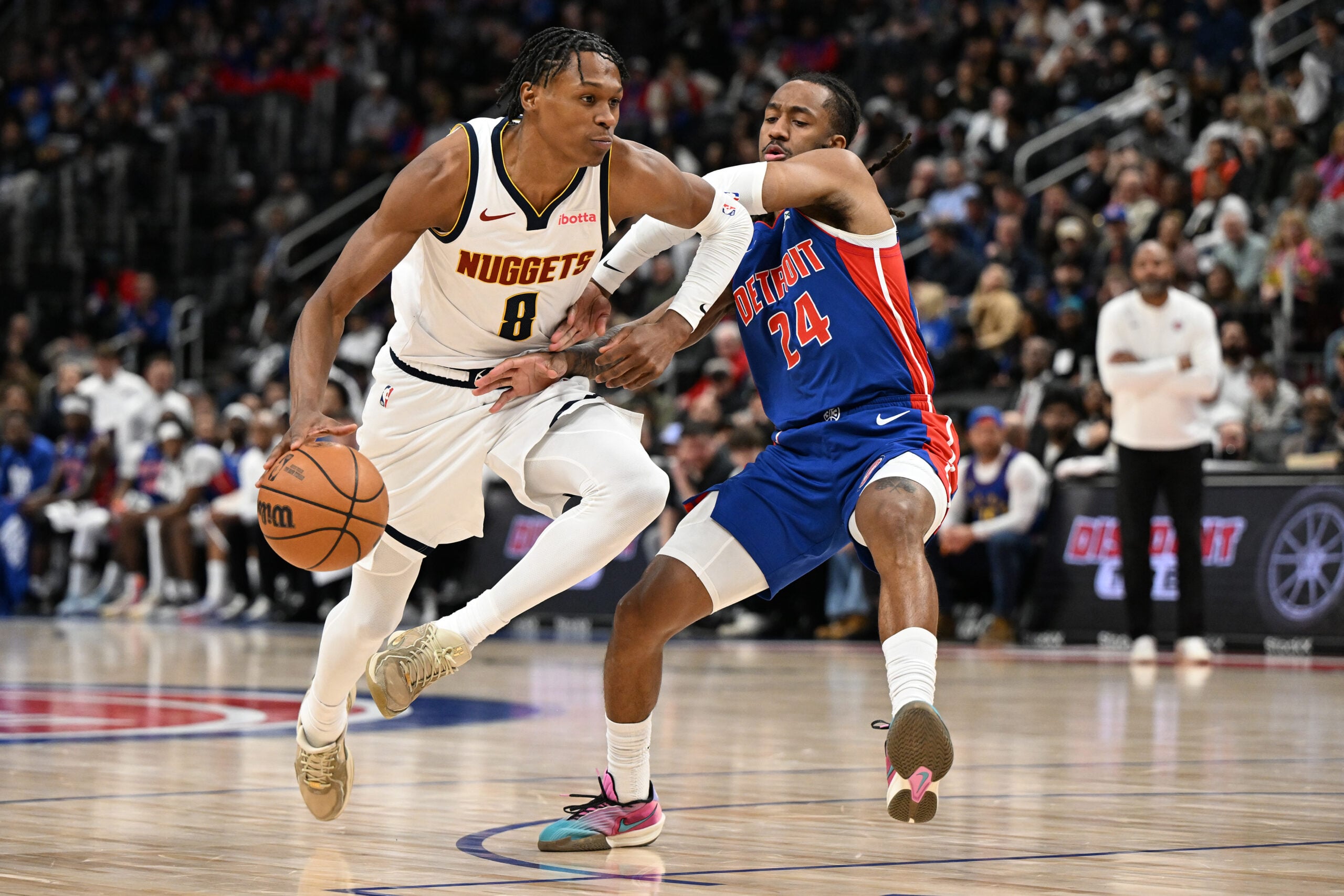 Feb 3, 2026; Detroit, Michigan, USA;  Denver Nuggets guard Peyton Watson (8) tries to drive past Detroit Pistons guard Daniss Jenkins (24) in the fourth quarter at Little Caesars Arena. Mandatory Credit: Lon Horwedel-Imagn Images