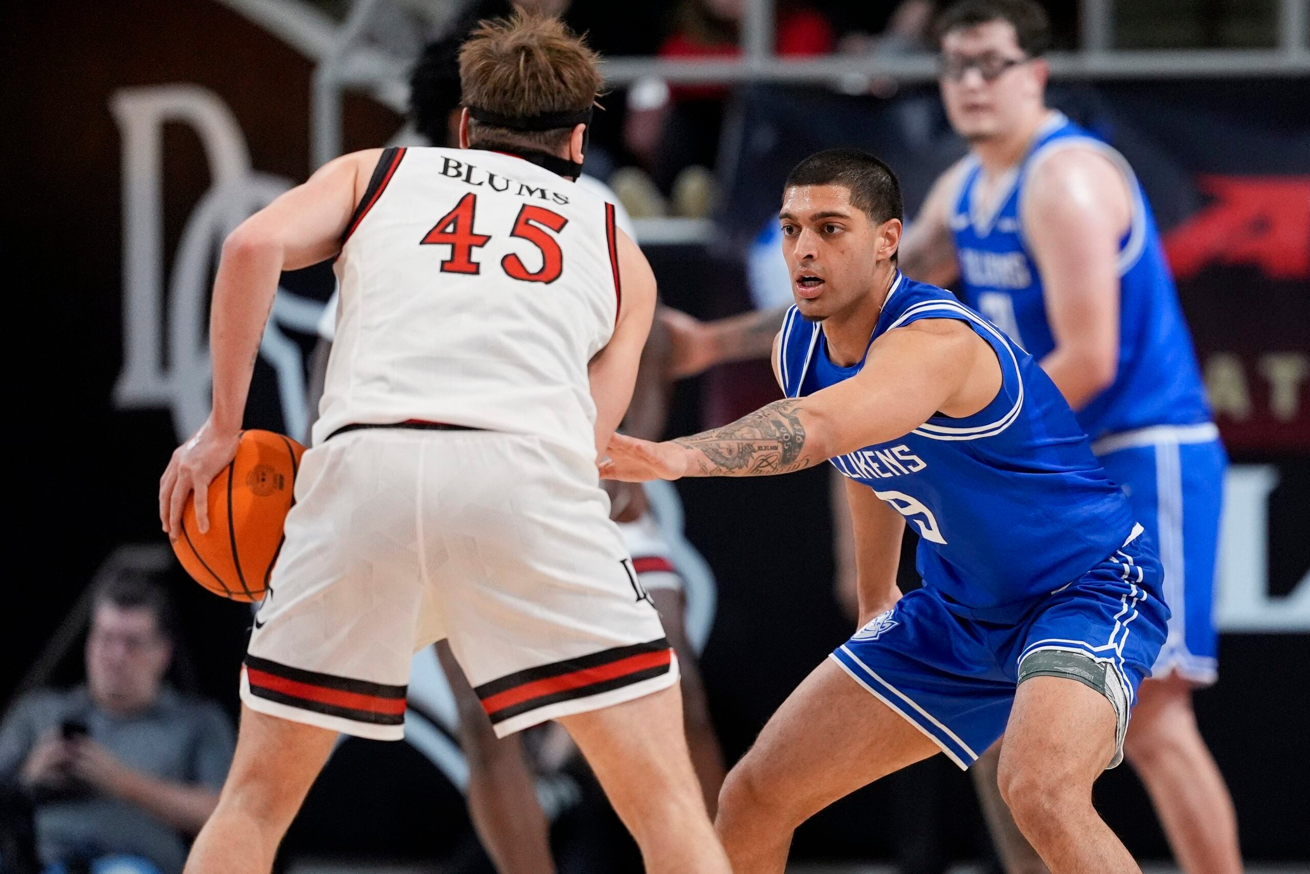 Feb 3, 2026; Davidson, North Carolina, USA; Saint Louis Billikens forward Ishan Sharma (9) on defense against Davidson Wildcats guard Roberts Blums (45) during the second half at McKillop Court at John M. Belk Arena. Mandatory Credit: Jim Dedmon-Imagn Images