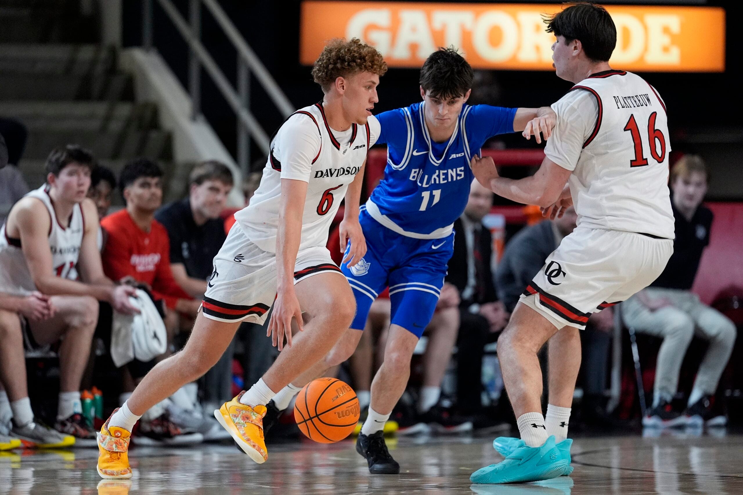 Feb 3, 2026; Davidson, North Carolina, USA; Davidson Wildcats guard Devin Brown (6) handles the ball defended by Saint Louis Billikens forward Brady Dunlap (11) during the second half at McKillop Court at John M. Belk Arena. Mandatory Credit: Jim Dedmon-Imagn Images