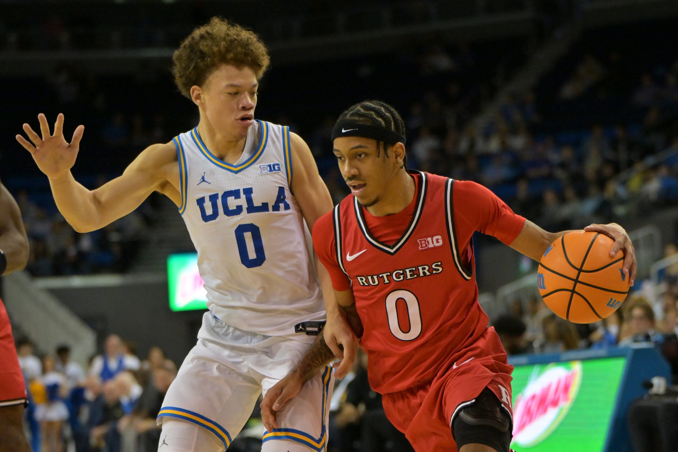 Feb 3, 2026; Los Angeles, California, USA; Rutgers Scarlet Knights guard Tariq Francis (0) is defended by UCLA Bruins guard Trent Perry (0) in the second half at Pauley Pavilion presented by Wescom Financial. Mandatory Credit: Jayne Kamin-Oncea-Imagn Images