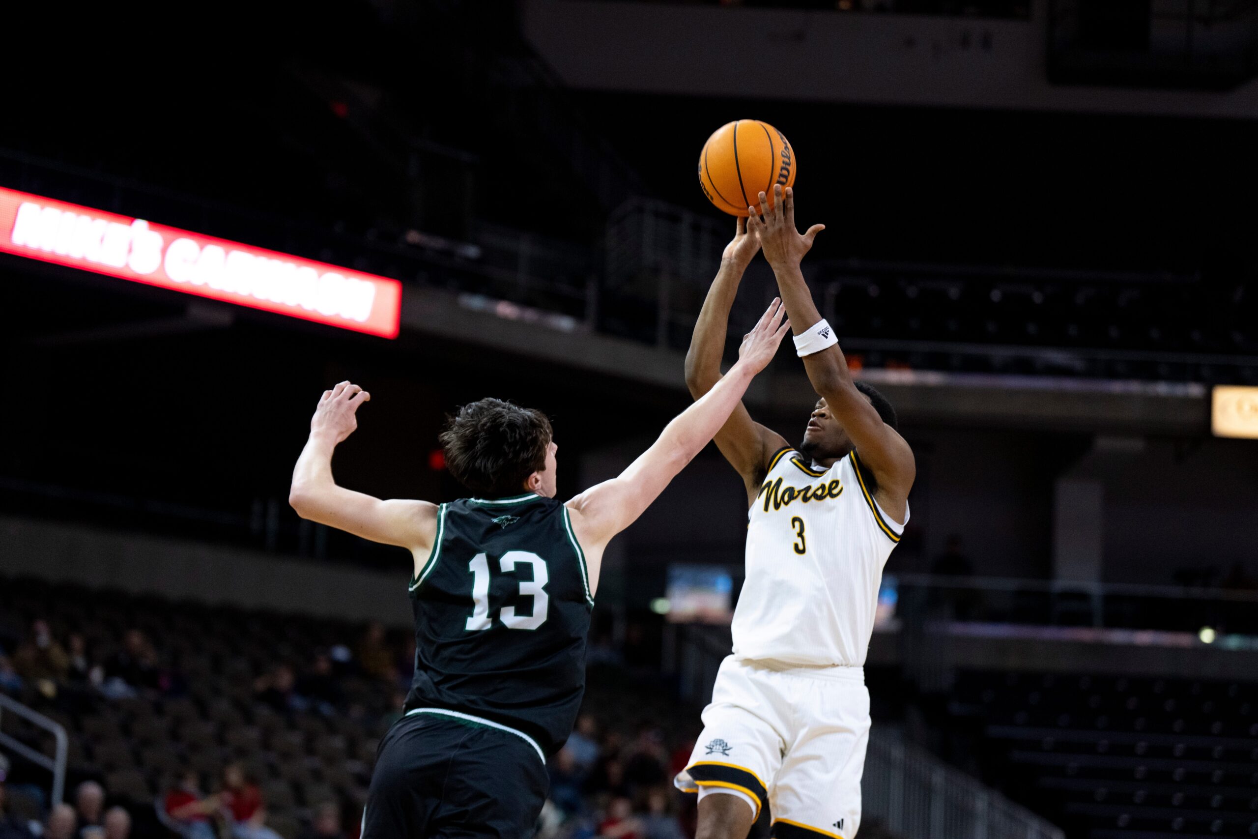 NKU Norse guard Shawn Nelson (3) hits a basket over Green Bay Phoenix forward Marcus Hall (13) in the second half of the NCAA basketball game at Truist Arena in Highland Heights, Ky., on Wednesday, Feb. 4, 2026.