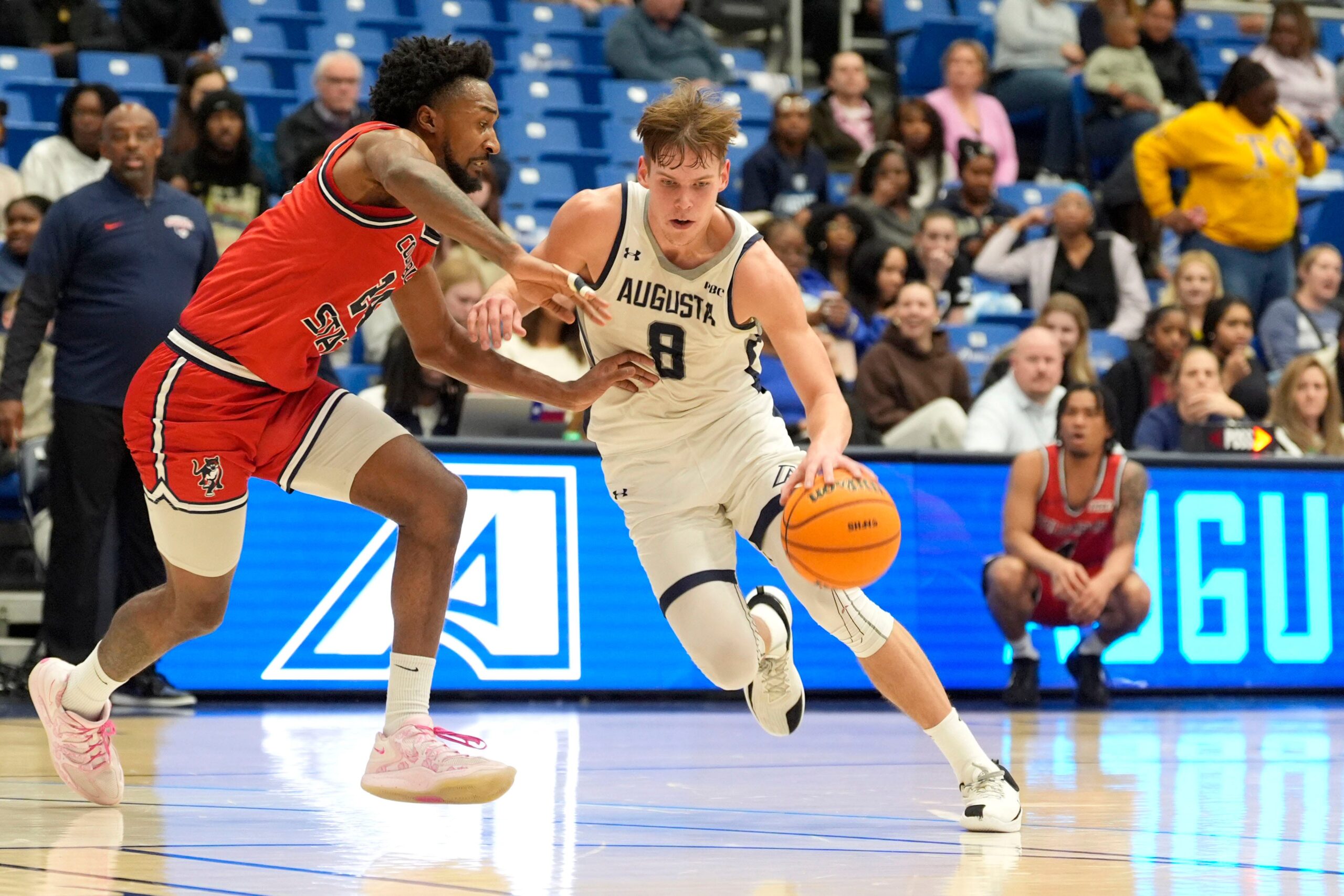 Augusta University guard El’as P‡lsson (8) moves towards the basket as Columbus State forward Jordan Mitchell (24) defends during the Augusta University men's basketball game against Columbus State University at Christenberry Fieldhouse in Augusta, Ga., on Wednesday, Feb. 4, 2026. Columbus State won 70-67. Mandatory Credit: Katie Goodale - Augusta Chronicle/USA TODAY NETWORK