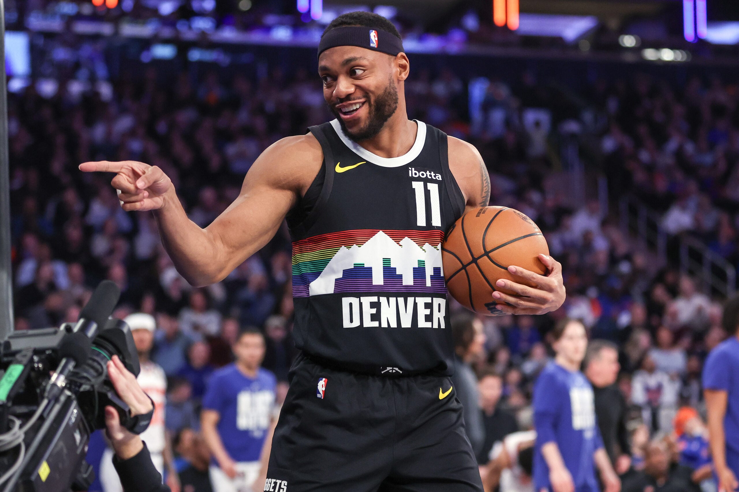 Feb 4, 2026; New York, New York, USA;  Denver Nuggets guard Bruce Brown (11) points to a fan after making a jump shot at the buzzer to end the first quarter against the New York Knicks at Madison Square Garden. Mandatory Credit: Wendell Cruz-Imagn Images