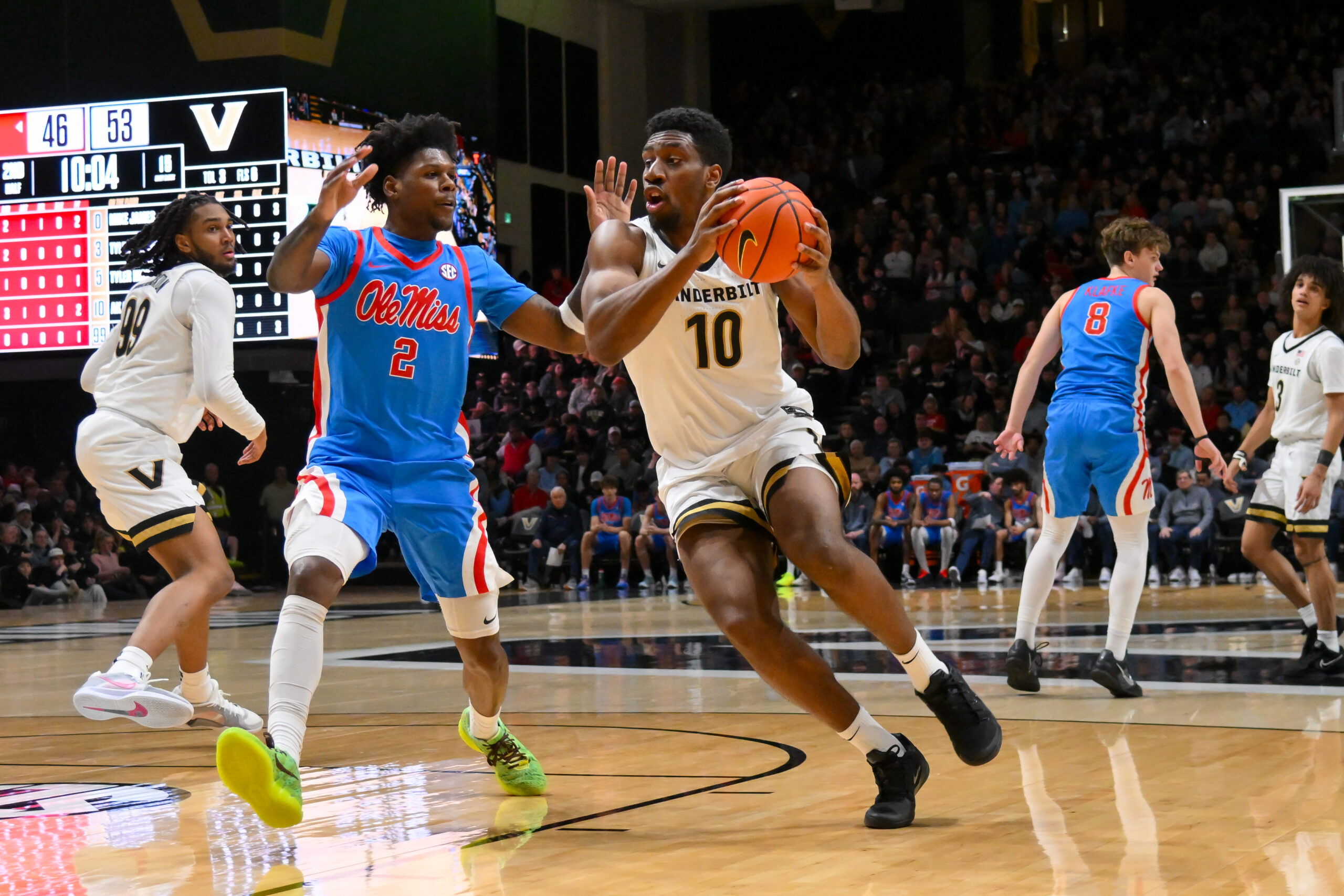 Jan 31, 2026; Nashville, TN, USA; Vanderbilt Commodores forward Ak Okereke (10) drives to the basket past Mississippi Rebels guard AJ Storr (2) during the second half at Memorial Gymnasium. Mandatory Credit: Steve Roberts-Imagn Images