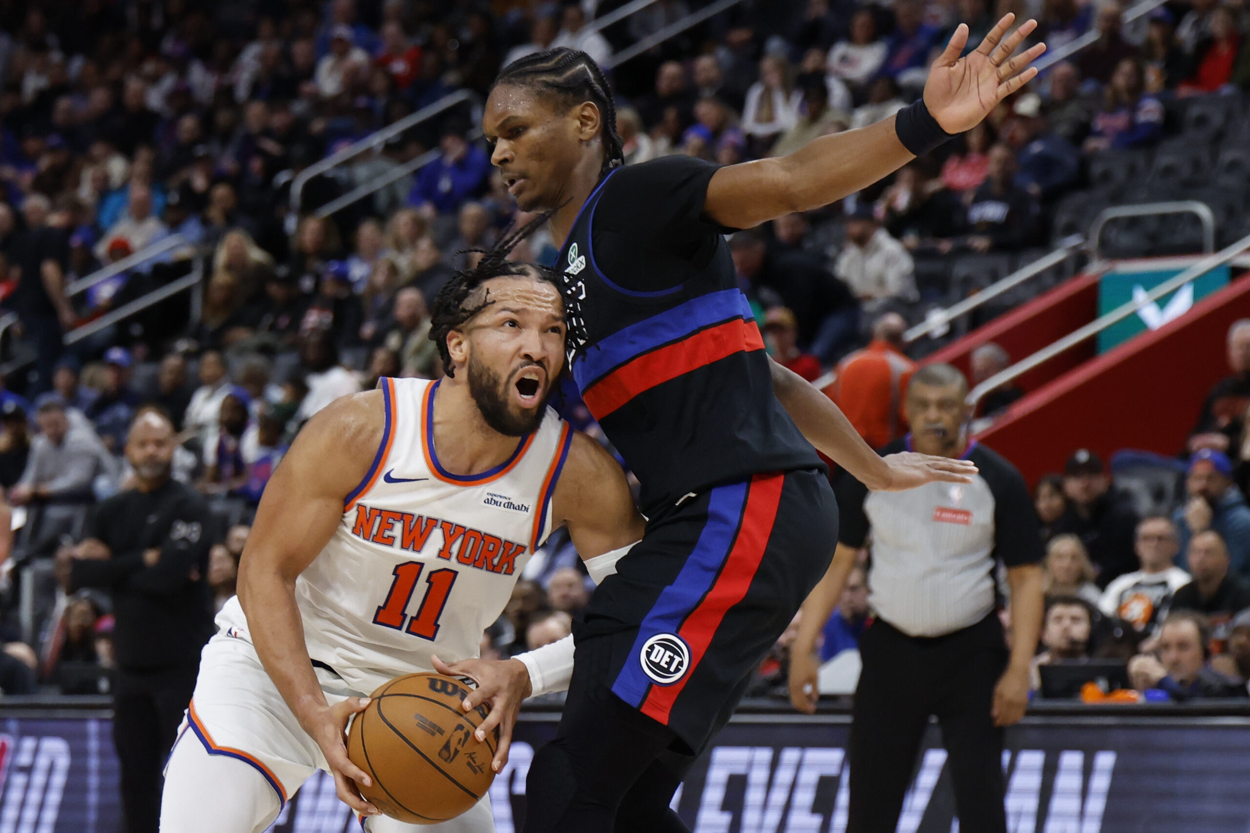 Feb 6, 2026; Detroit, Michigan, USA;  New York Knicks guard Jalen Brunson (11) dribbles on Detroit Pistons guard Ausar Thompson (9) in the first half at Little Caesars Arena. Mandatory Credit: Rick Osentoski-Imagn Images