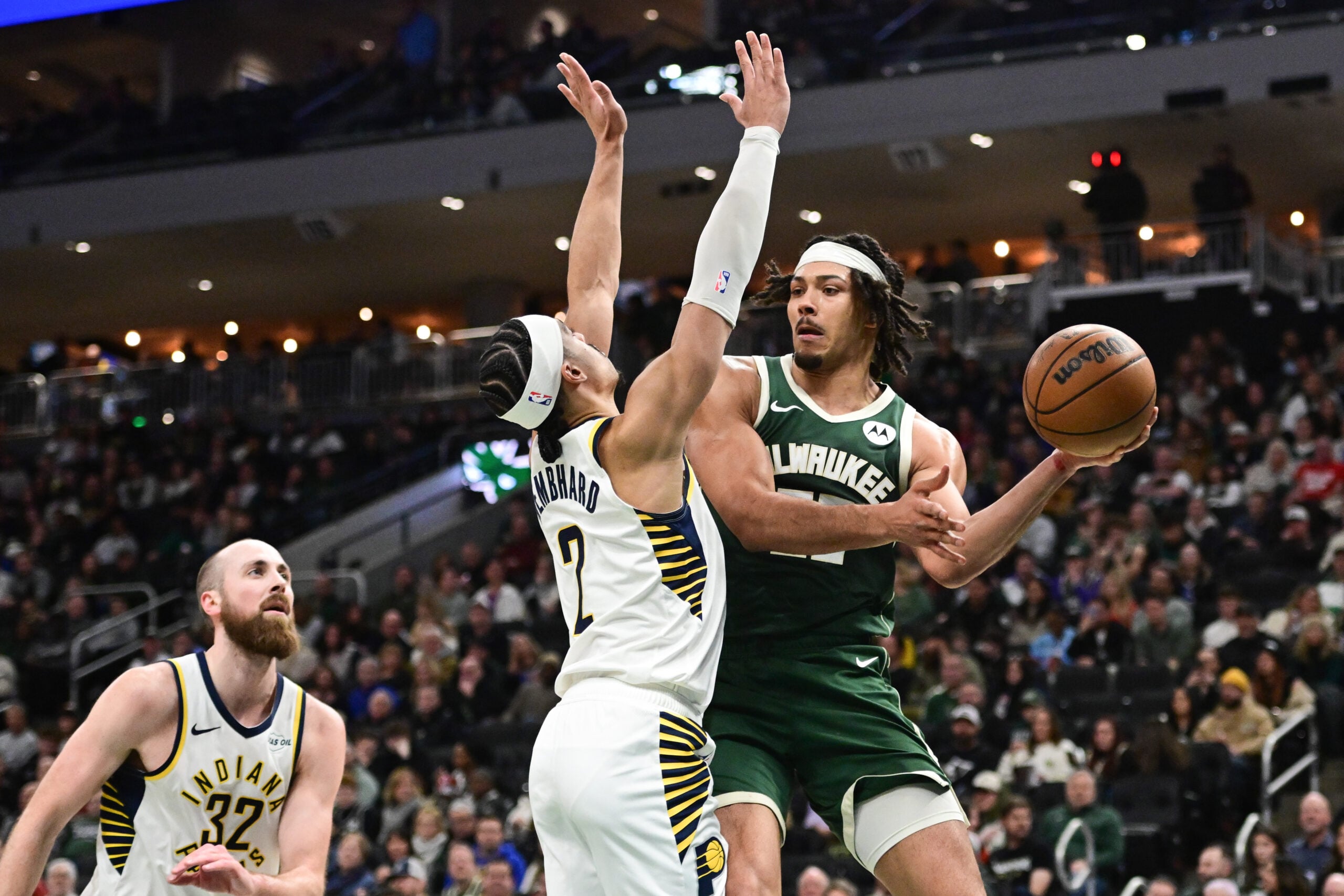 Feb 6, 2026; Milwaukee, Wisconsin, USA; Milwaukee Bucks center Jericho Sims (00) looks to pass the ball away from Indiana Pacers guard Andrew Nembhard (2) in the third quarter at Fiserv Forum. Mandatory Credit: Benny Sieu-Imagn Images