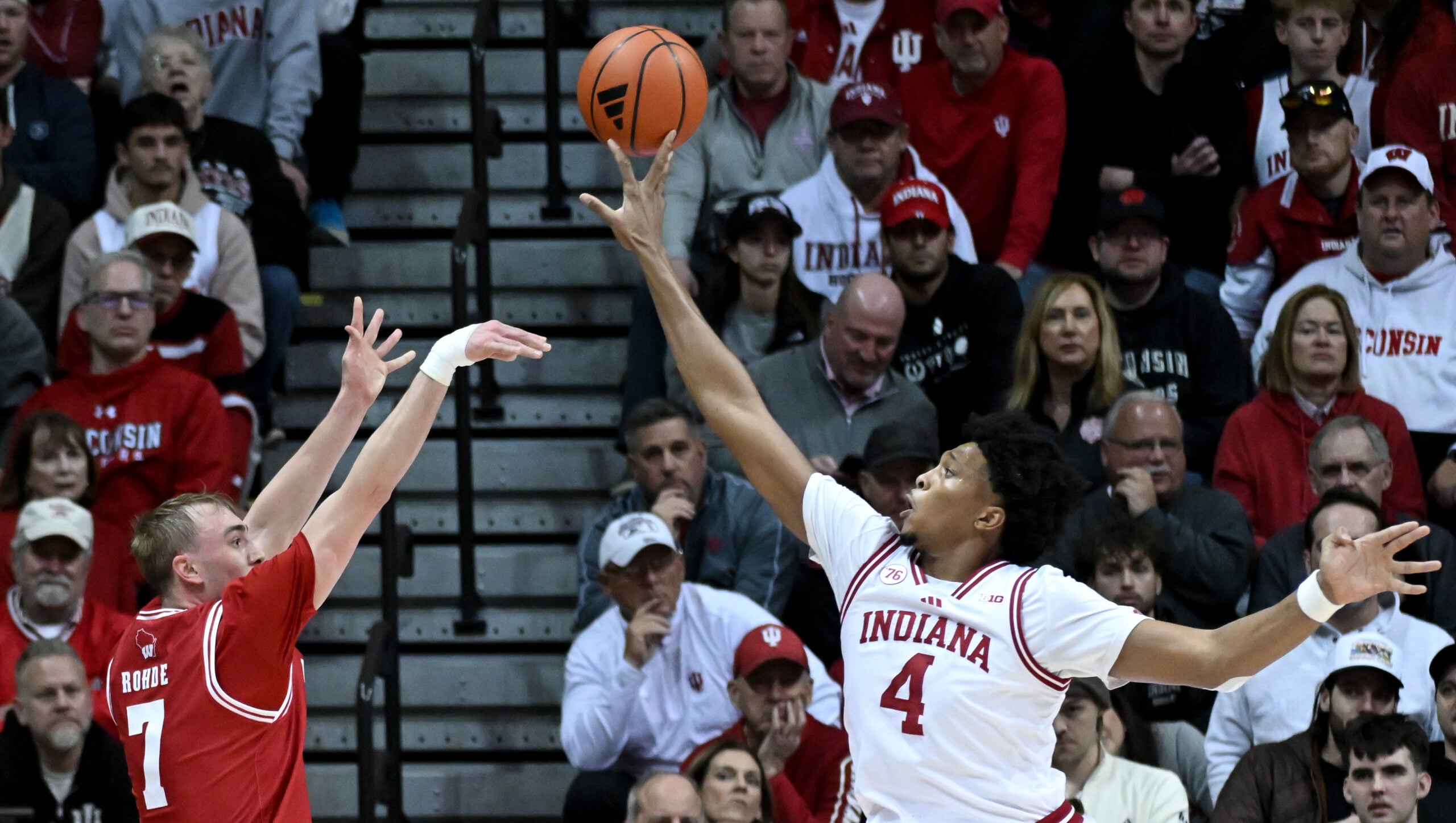 Feb 7, 2026; Bloomington, Indiana, USA; Indiana Hoosiers forward Sam Alexis (4) blocks a shot attempt from Wisconsin Badgers guard Andrew Rohde (7) during the first half at Simon Skjodt Assembly Hall. Mandatory Credit: Robert Goddin-Imagn Images