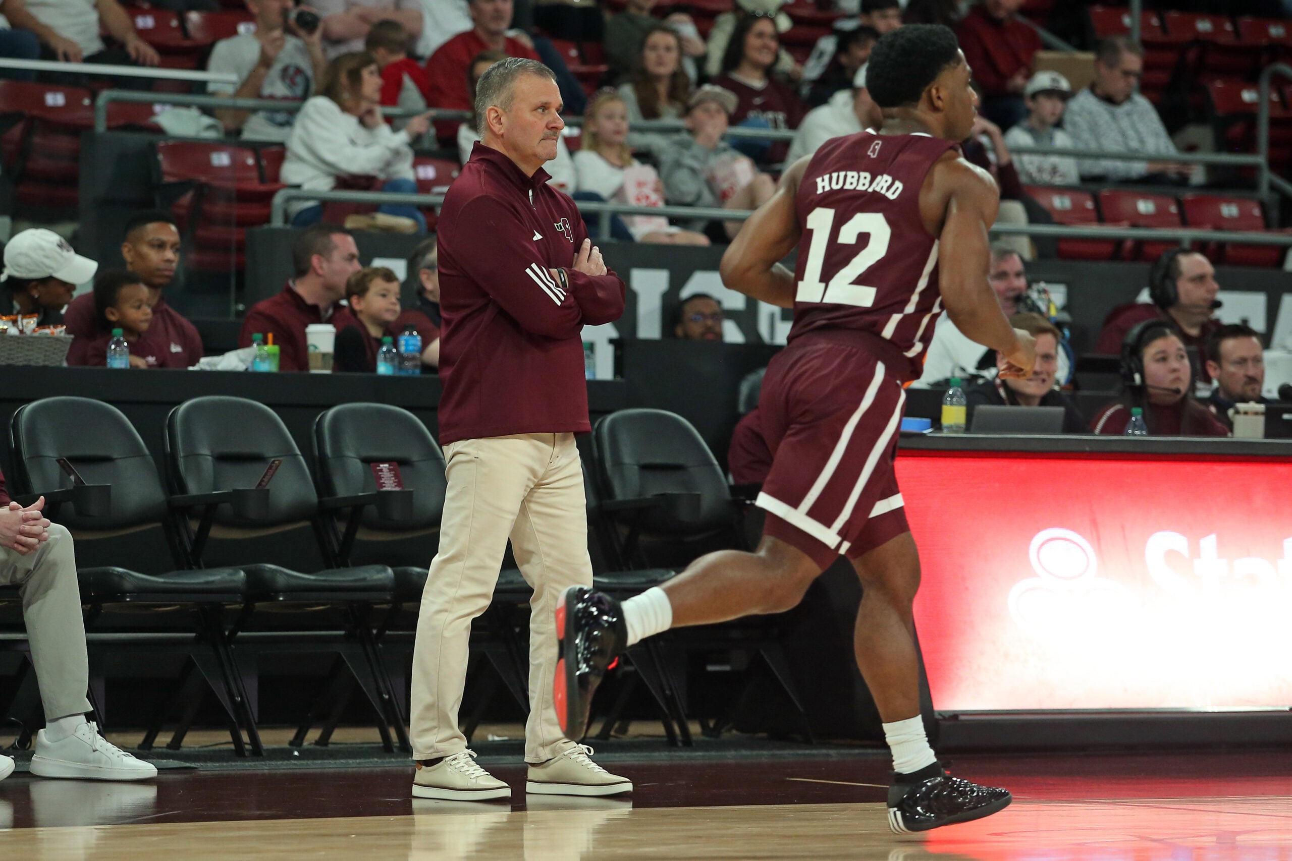 Feb 7, 2026; Starkville, Mississippi, USA; Mississippi State Bulldogs head coach Chris Jans looks on as guard Josh Hubbard (12) dribbles up the court during the first half against the Arkansas Razorbacks at Humphrey Coliseum. Mandatory Credit: Petre Thomas-Imagn Images