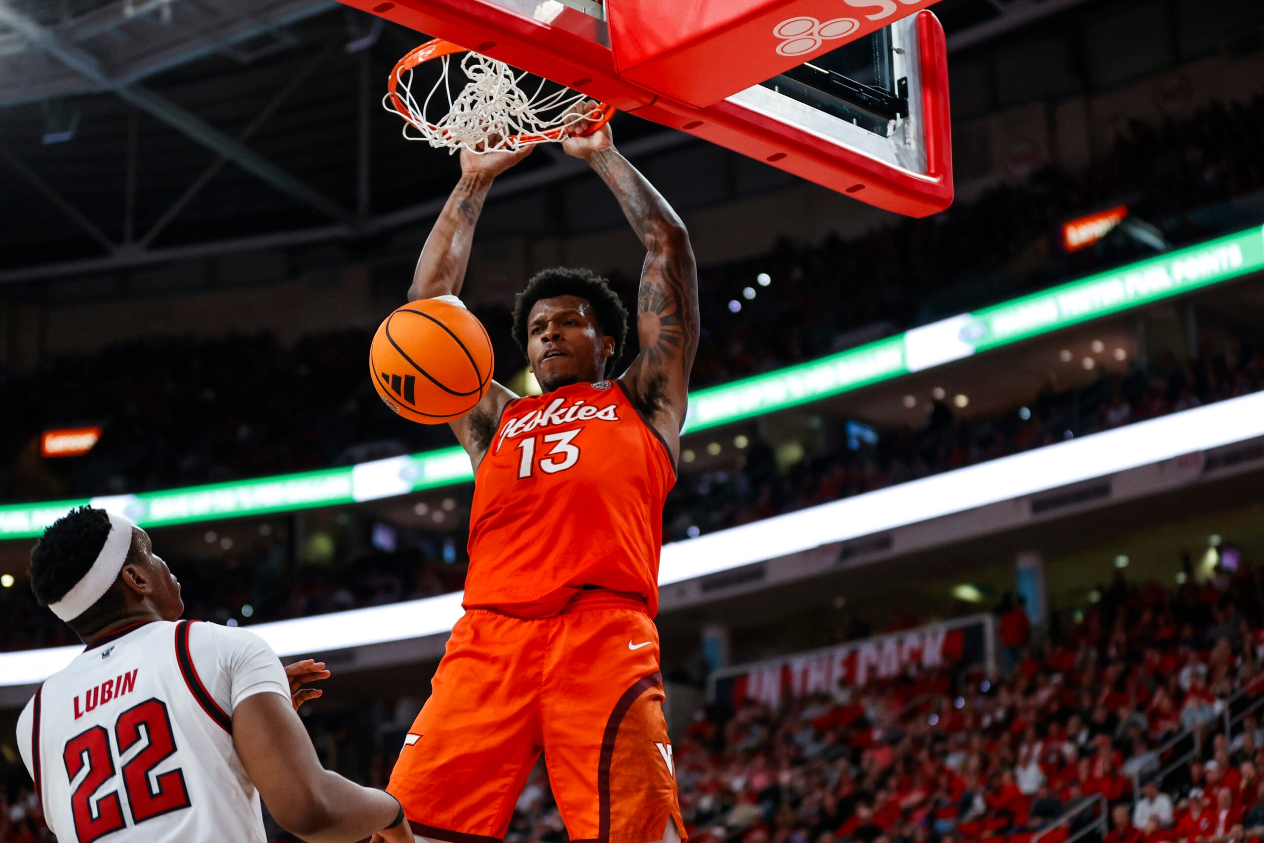 Feb 7, 2026; Raleigh, North Carolina, USA; Virginia Tech Hokies forward Amani Hansberry (13) dunks the ball during the second half of the game against the NC State Wolfpack at Lenovo Center. Mandatory Credit: Jaylynn Nash-Imagn Images