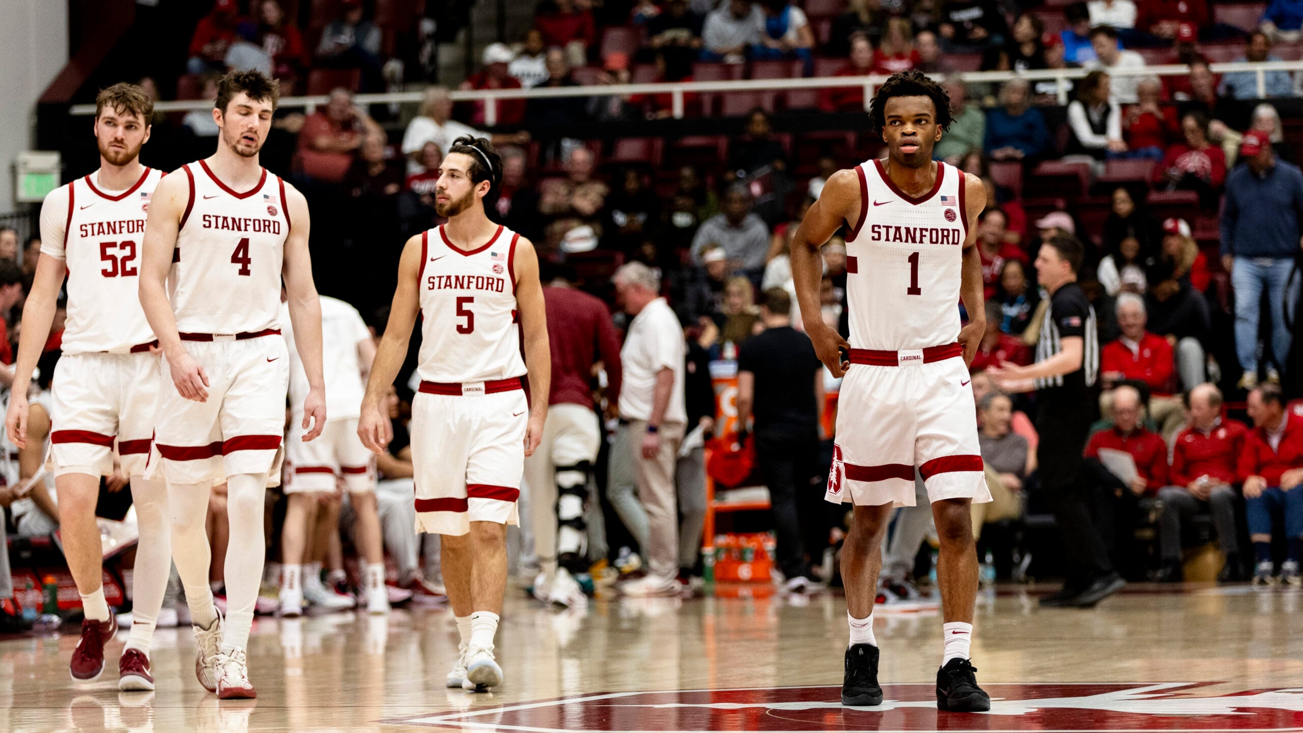 Feb 7, 2026; Stanford, California, USA; Stanford Cardinal guard Ebuka Okorie (1) andguard Benny Gealer (5) and forward AJ Rohosy (4) and forward Aidan Cammann (52) enter the court after a time-out in the second half against the Georgia Tech Yellow Jackets at Maples Pavilion. Mandatory Credit: John Hefti-Imagn Images