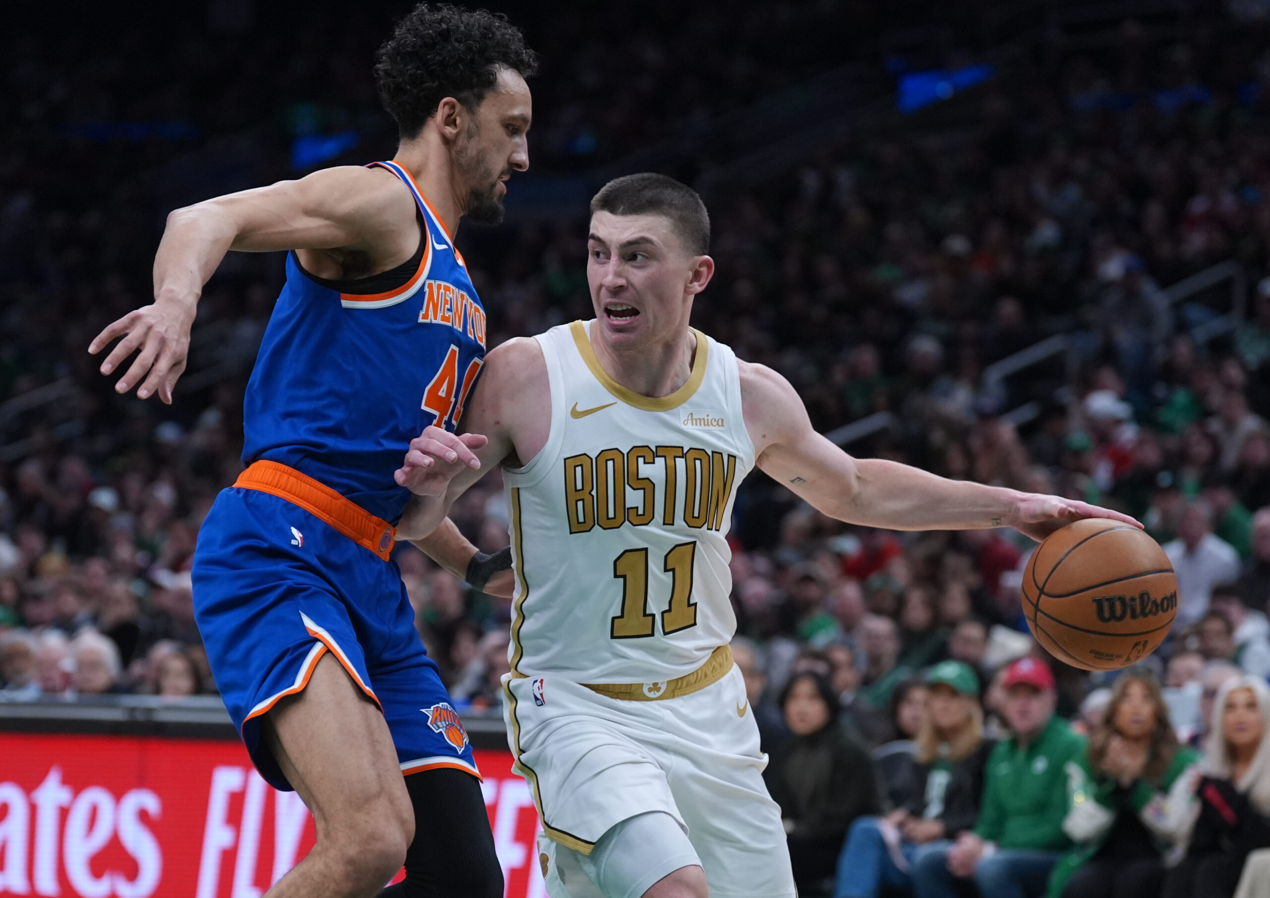 Feb 8, 2026; Boston, Massachusetts, USA; Boston Celtics guard Payton Pritchard (11) looks for an opening past New York Knicks guard Landry Shamet (44) in the second half at TD Garden. Mandatory Credit: David Butler II-Imagn Images