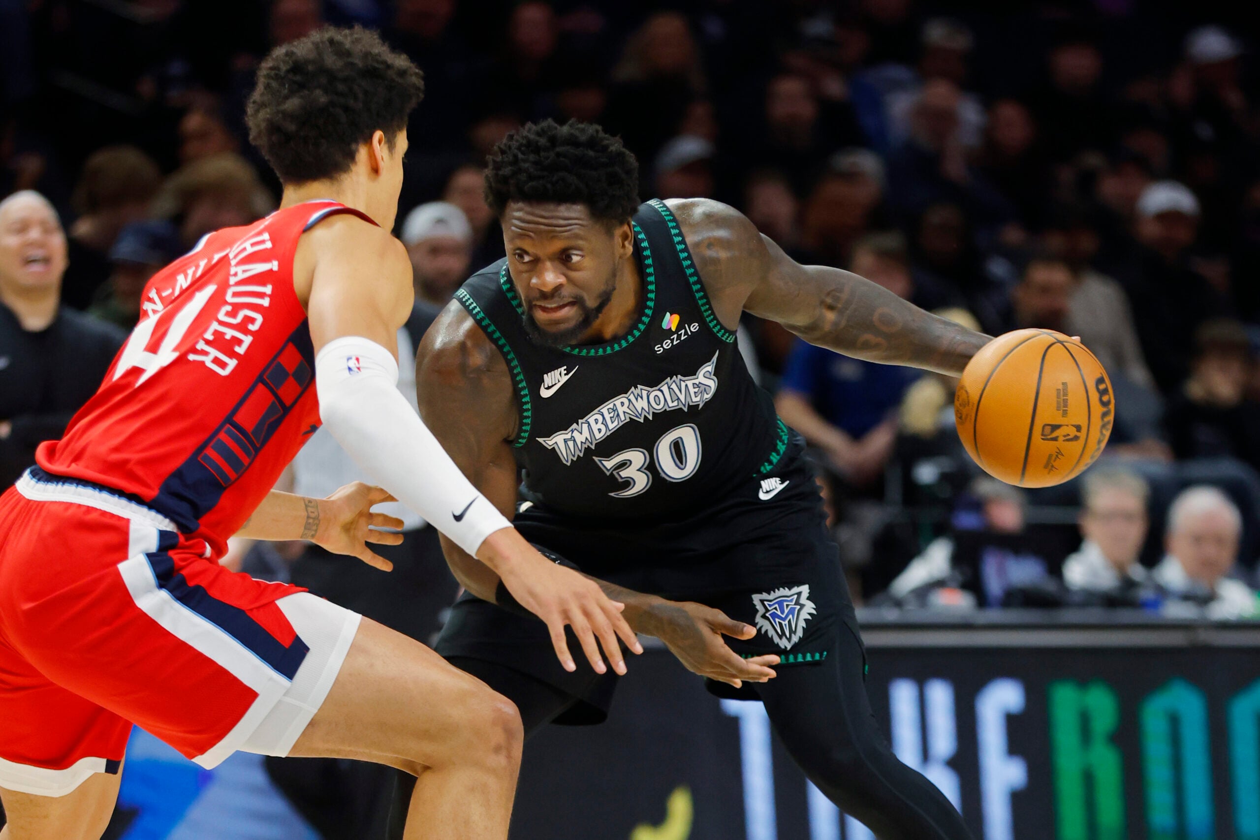 Feb 8, 2026; Minneapolis, Minnesota, USA; Minnesota Timberwolves forward Julius Randle (30) works around Los Angeles Clippers center Yanic Konan Niederhauser (14) in the second quarter at Target Center. Mandatory Credit: Bruce Kluckhohn-Imagn Images