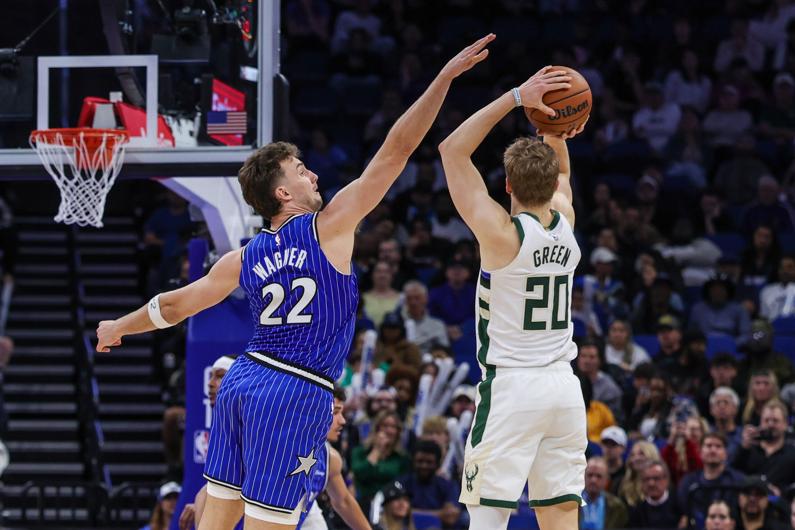 Feb 9, 2026; Orlando, Florida, USA; Orlando Magic forward Franz Wagner (22) defends Milwaukee Bucks guard AJ Green (20) during the second half at Kia Center. Mandatory Credit: Mike Watters-Imagn Images