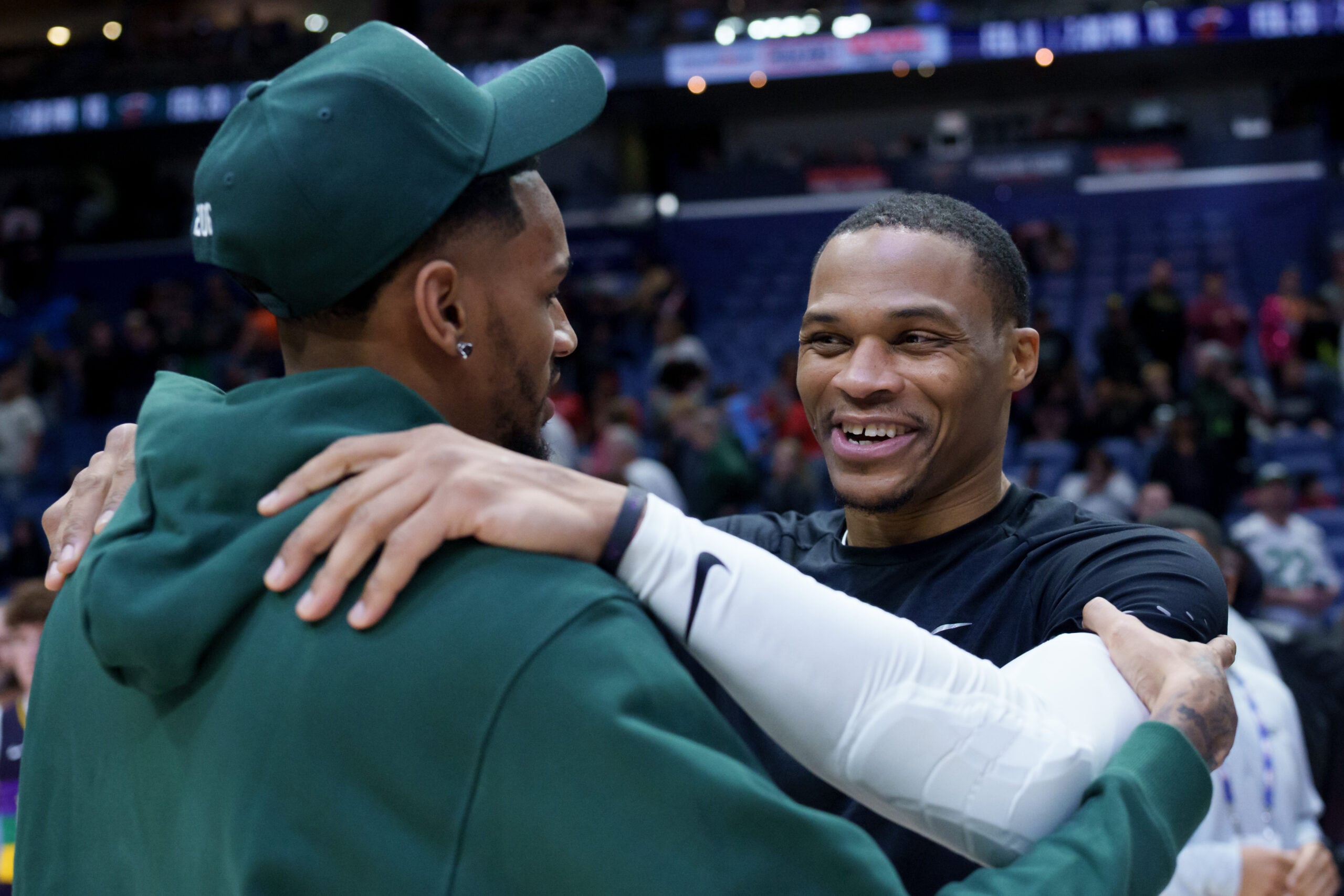 Feb 9, 2026; New Orleans, Louisiana, USA; Sacramento Kings guard Russell Westbrook, right, hugs New Orleans Pelicans guard Dejounte Murray at Smoothie King Center. Mandatory Credit: Matthew Hinton-Imagn Images