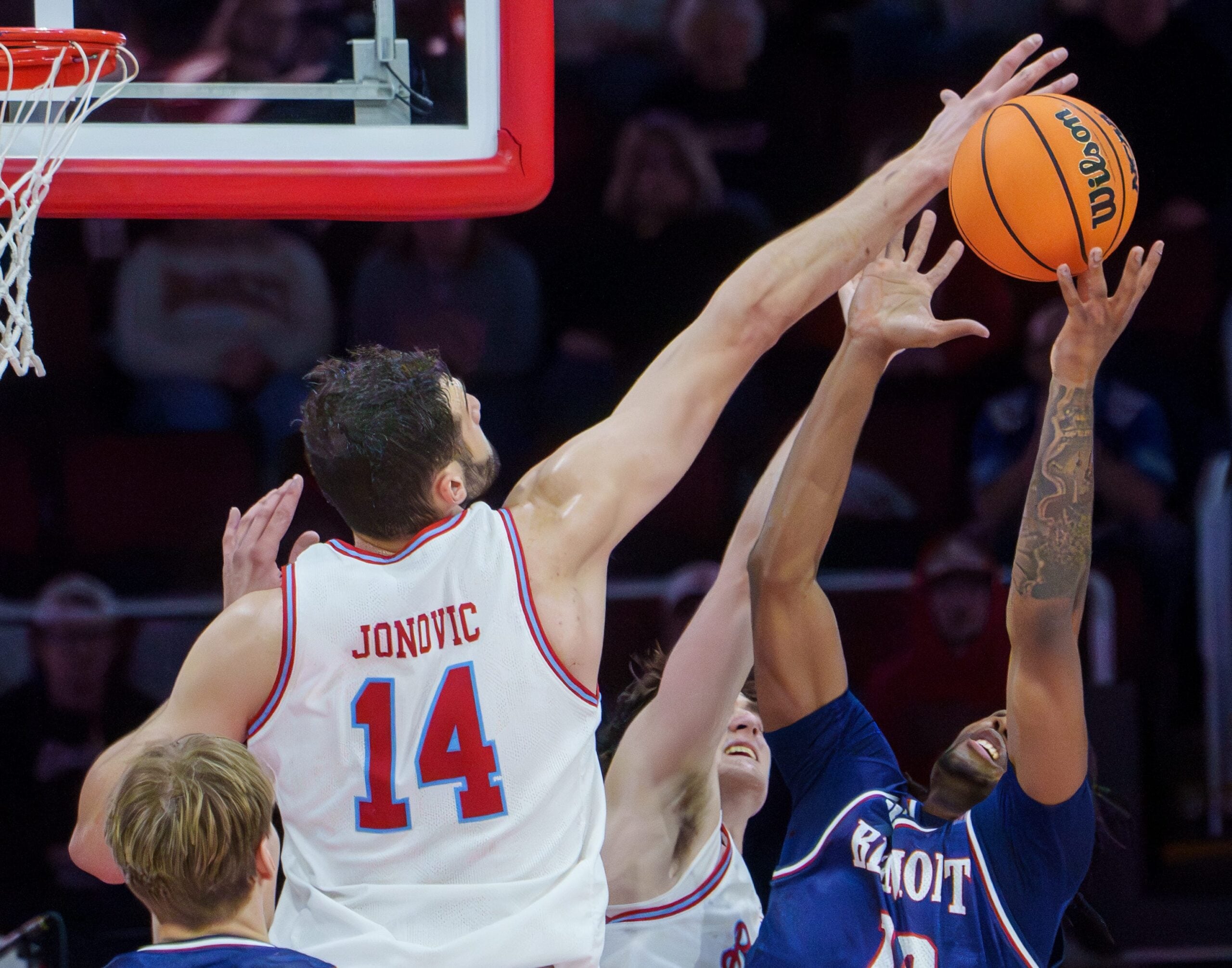 Bradley’s Ahmet Jonovic (14) tries to knock a rebound away from Belmont’s Jabez Jenkins in the overtime period of their college basketball game Monday, Feb. 9, 2026 at Carver Arena in Peoria. The Braves defeated the Bruins 95-84.