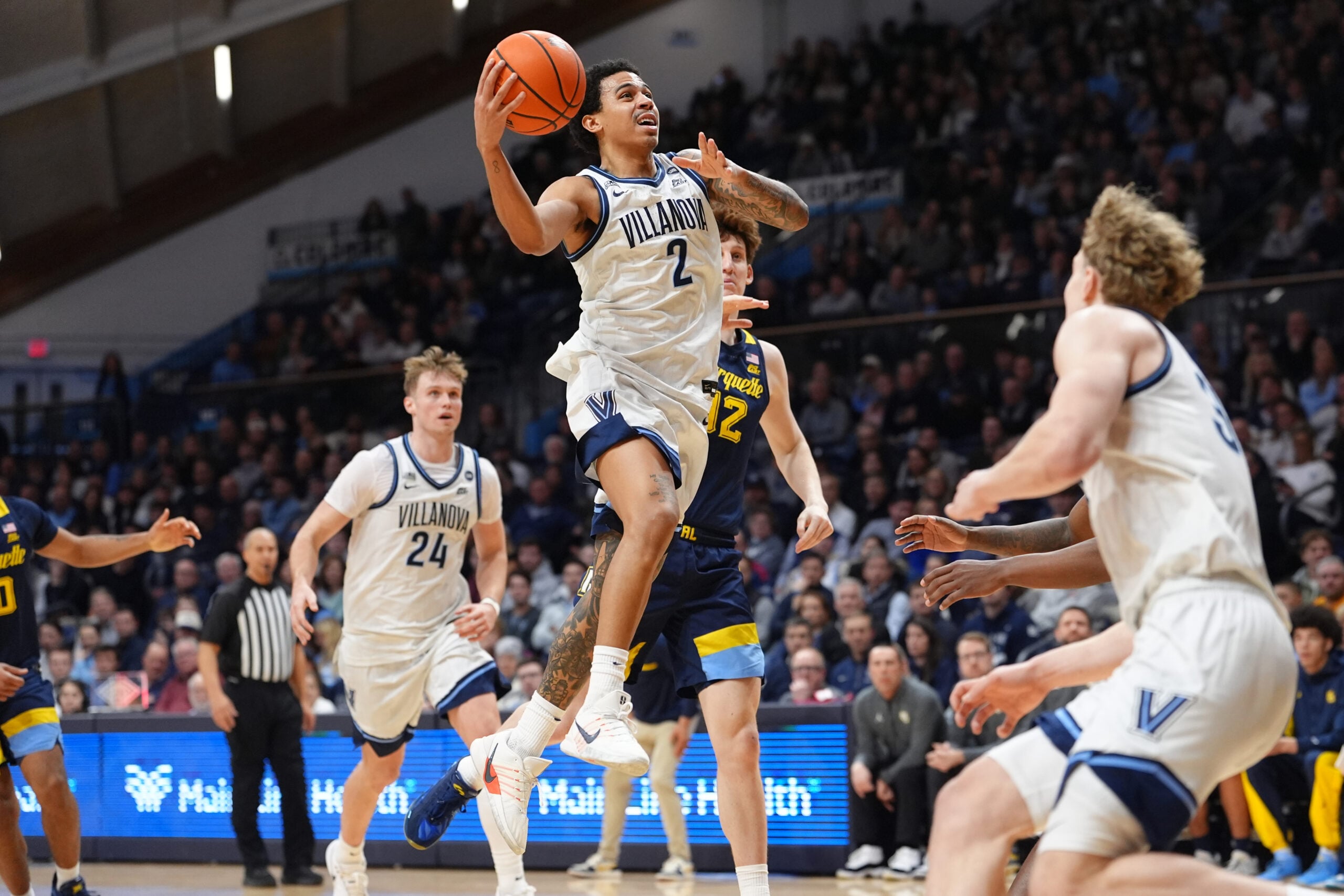 Feb 10, 2026; Villanova, Pennsylvania, USA; Villanova Wildcats guard Bryce Lindsay (2) drives to shoot against Marquette Golden Eagles forward Ben Gold (12) in the first half at William B. Finneran Pavilion. Mandatory Credit: Kyle Ross-Imagn Images