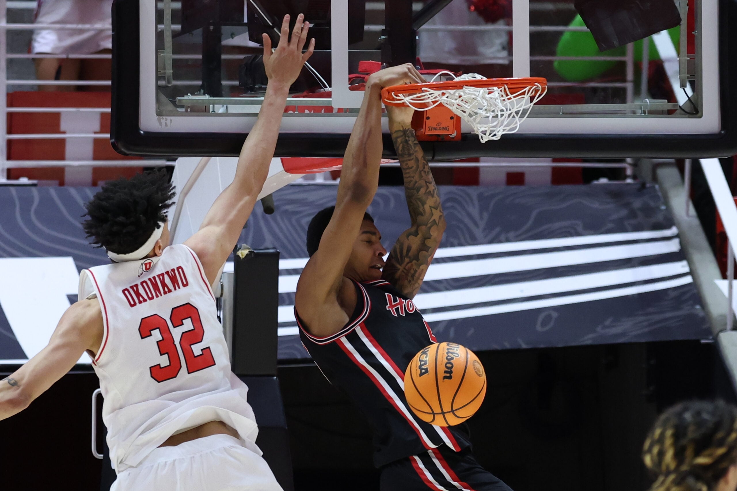 Feb 10, 2026; Salt Lake City, Utah, USA; Houston Cougars center Chris Cenac Jr. (5) dunks the ball against Utah Utes forward James Okonkwo (32) during the second half at Jon M. Huntsman Center. Mandatory Credit: Rob Gray-Imagn Images