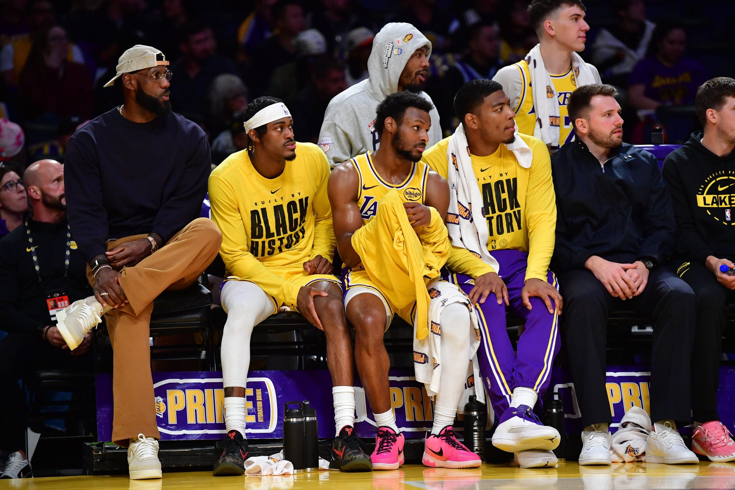 Feb 10, 2026; Los Angeles, California, USA; Los Angeles Lakers forward LeBron James (23) forward Jarred Vanderbilt (2) guard Bronny James (9) and forward Rui Hachimura (28) watch game action during the second half at Crypto.com Arena. Mandatory Credit: Gary A. Vasquez-Imagn Images