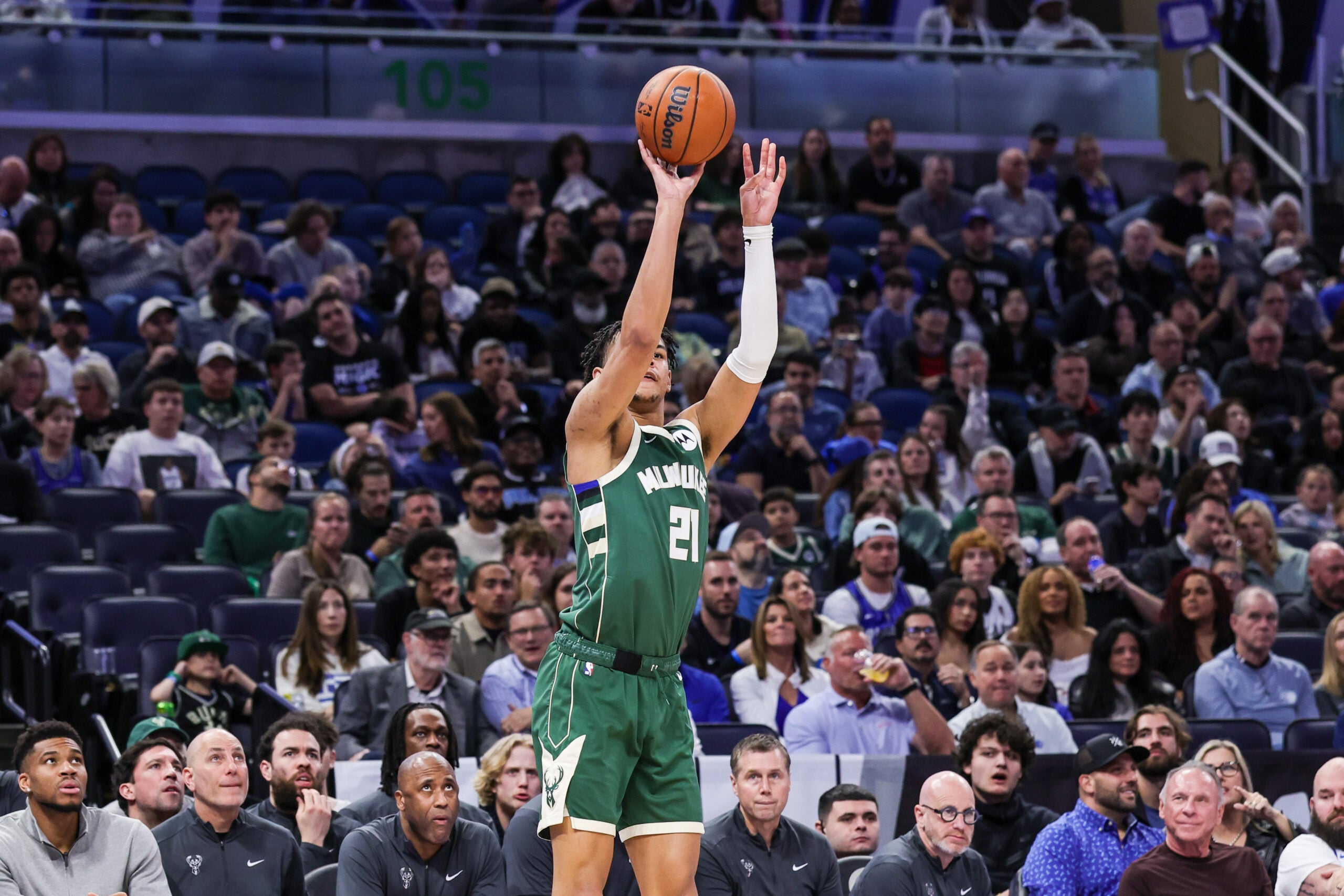Feb 11, 2026; Orlando, Florida, USA; Milwaukee Bucks forward Ousmane Dieng (21) shoots a three point basket during the second quarter against the Orlando Magic at Kia Center. Mandatory Credit: Mike Watters-Imagn Images