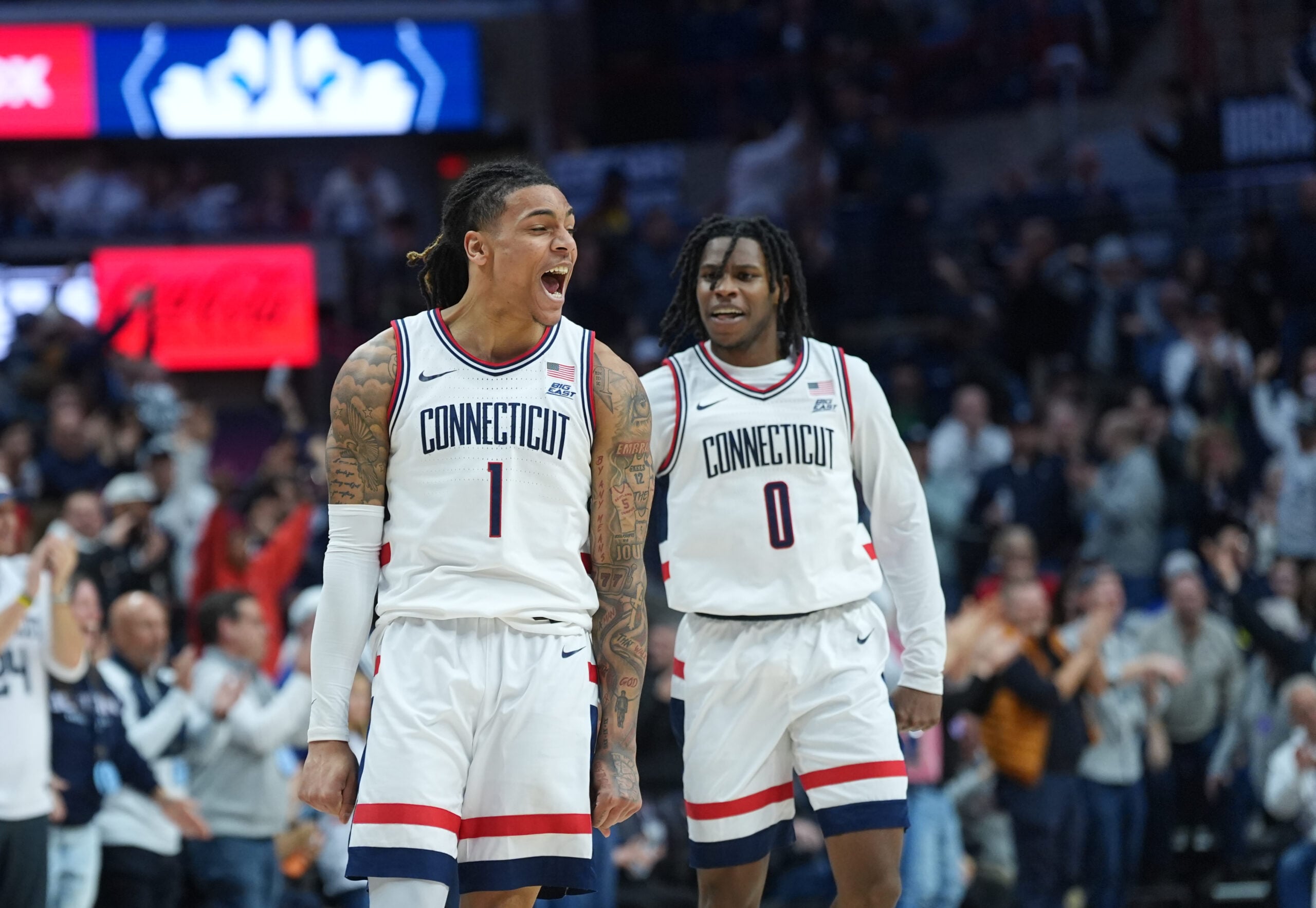 Feb 14, 2026; Storrs, Connecticut, USA; UConn Huskies guard Solo Ball (1) reacts after his three point basket against the Georgetown Hoyas in the second half at Harry A. Gampel Pavilion. Mandatory Credit: David Butler II-Imagn Images