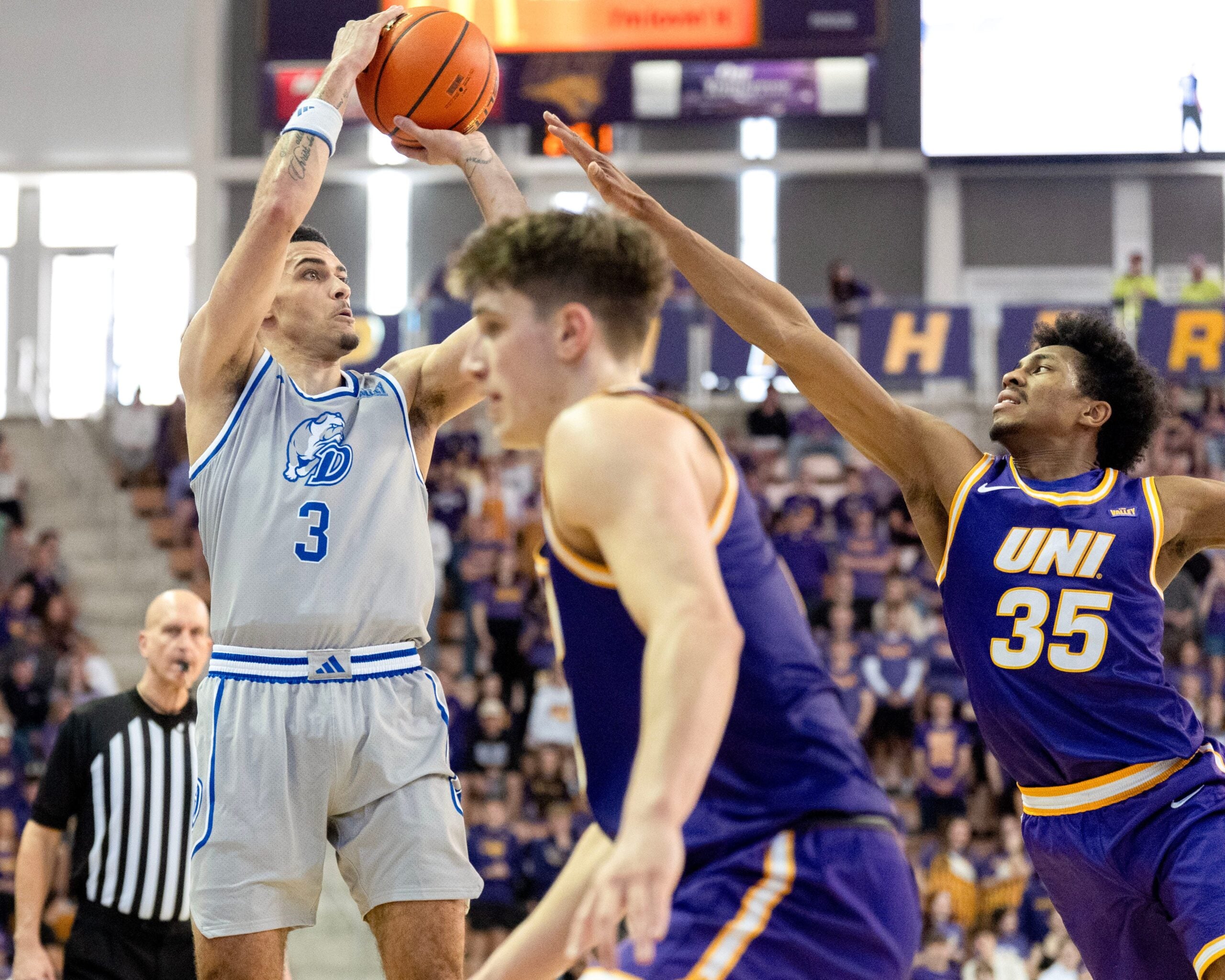 Drake guard Jalen Quinn (3) shoots the basketball as UNI’s Leon Bond III (35) defends Feb. 15, 2026 during a Missouri Valley Conference game at the McLeod Center in Cedar Falls, Iowa.