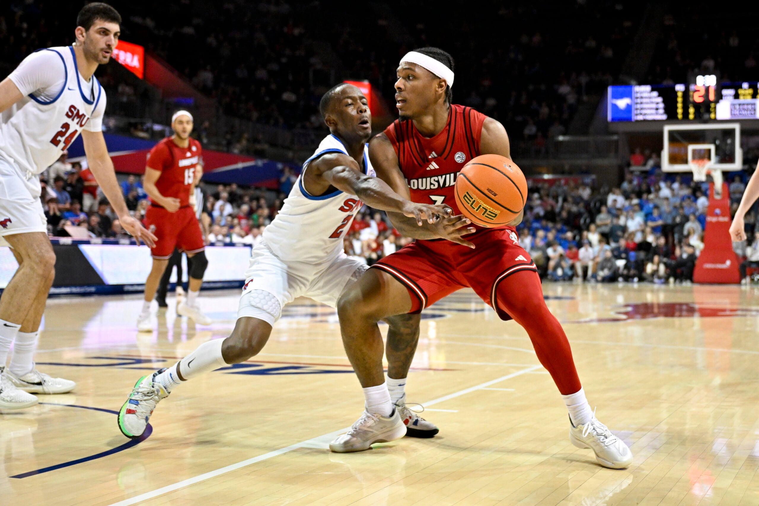 Feb 17, 2026; Dallas, Texas, USA; SMU Mustangs guard Boopie Miller (2) attempts to knock the ball away from Louisville Cardinals guard Ryan Conwell (3) during the first half at Moody Coliseum. Mandatory Credit: Jerome Miron-Imagn Images