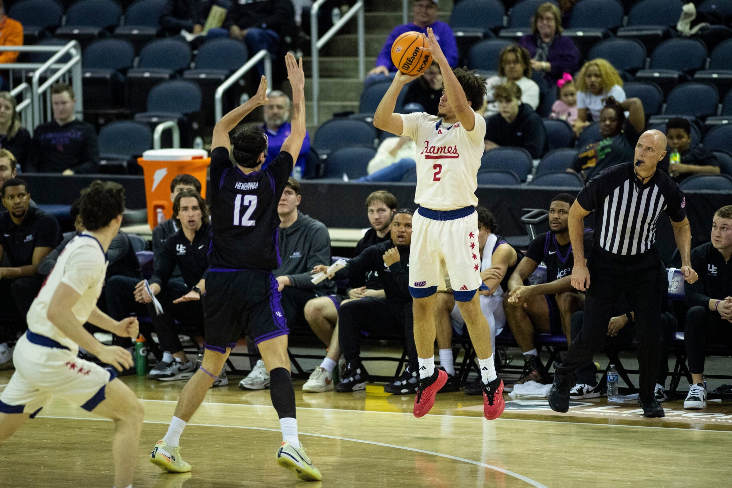 Illinois Chicago's Elijah Crawford (2) takes a three-point shot as the University of Evansville Purple Aces play the University of Illinois Chicago Flames at Ford Center in Evansville, Ind., Wednesday, Feb. 18, 2026.