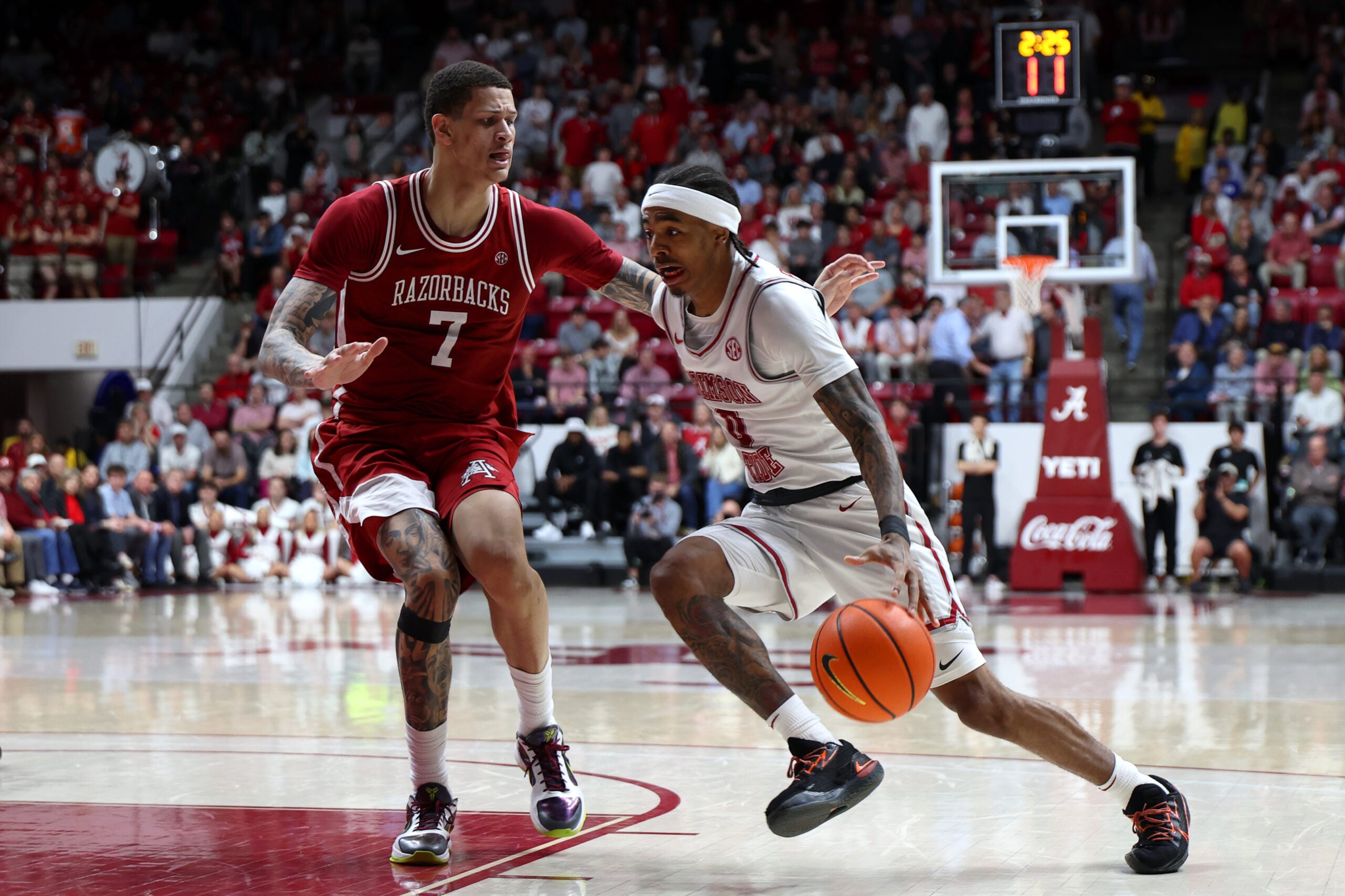 Feb 18, 2026; Tuscaloosa, Alabama, USA; Arkansas Razorback forward Trevon Brazile (7) guards Alabama Crimson Tide guard Labaron Philon (0) during the second half at Coleman Coliseum. Mandatory Credit: David Leong-Imagn Images