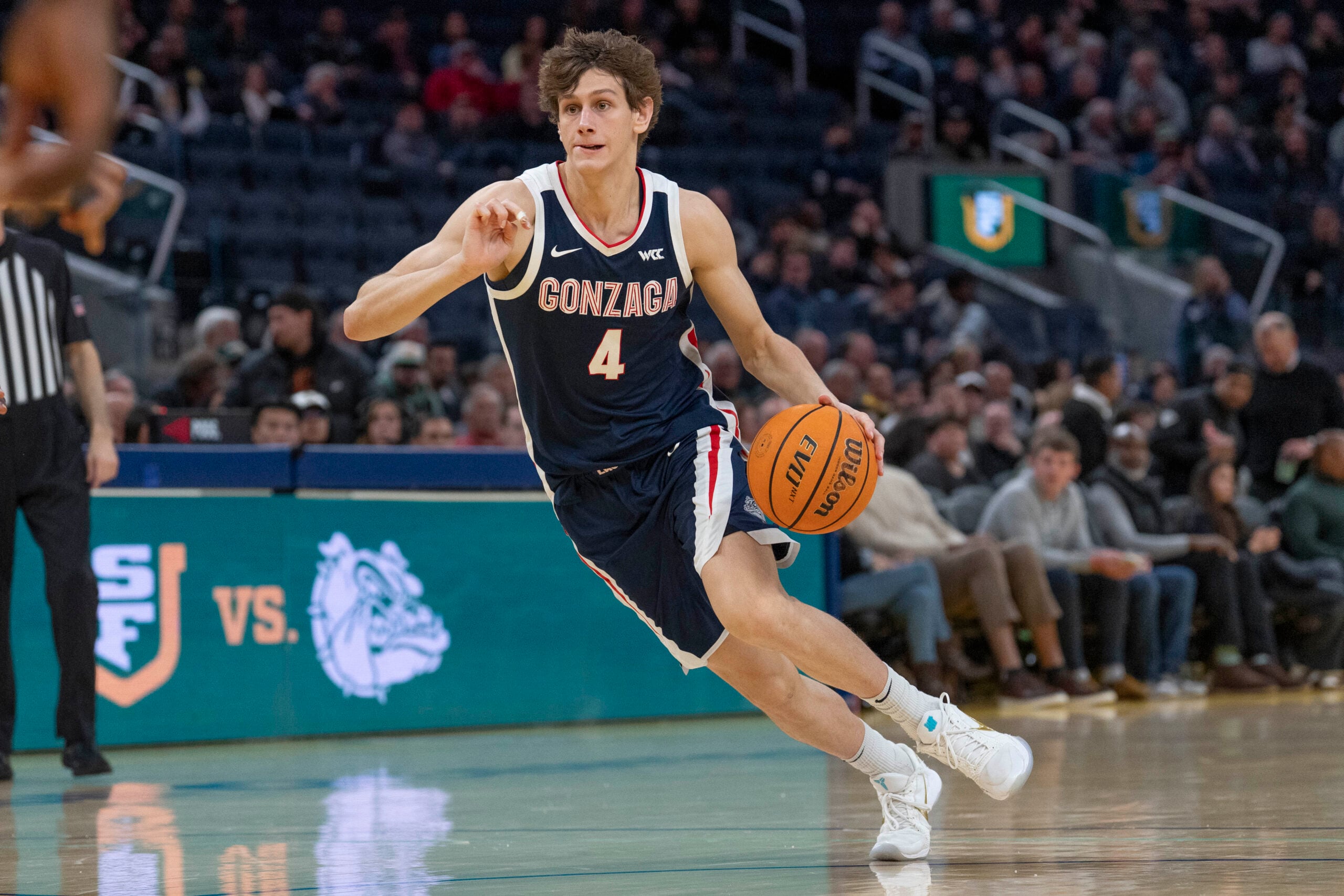 Feb 18, 2026; San Francisco, California, USA; Gonzaga Bulldogs guard Davis Fogle (4) drives the ball during the second half against the San Francisco Dons at Chase Center. Mandatory Credit: Stan Szeto-Imagn Images
