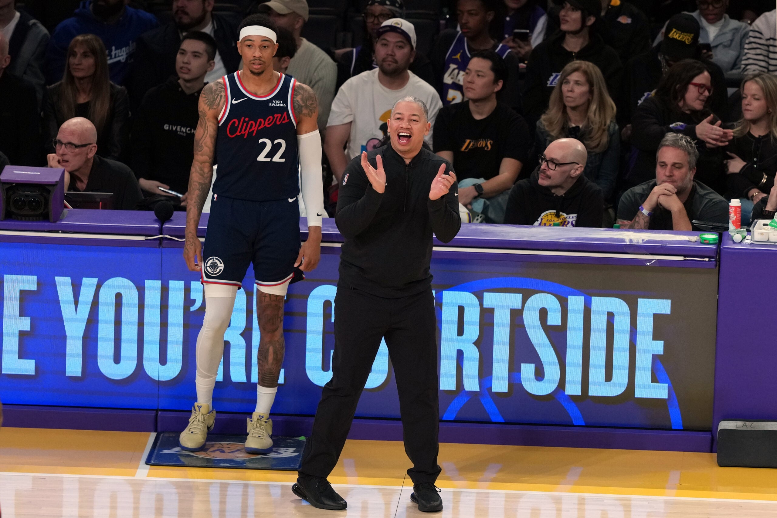 Feb 20, 2026; Los Angeles, California, USA; LA Clippers head coach Tyronn Lue and guard Jordan Miller (22) react against the Los Angeles Lakers in the second half at Crypto.com Arena. Mandatory Credit: Kirby Lee-Imagn Images