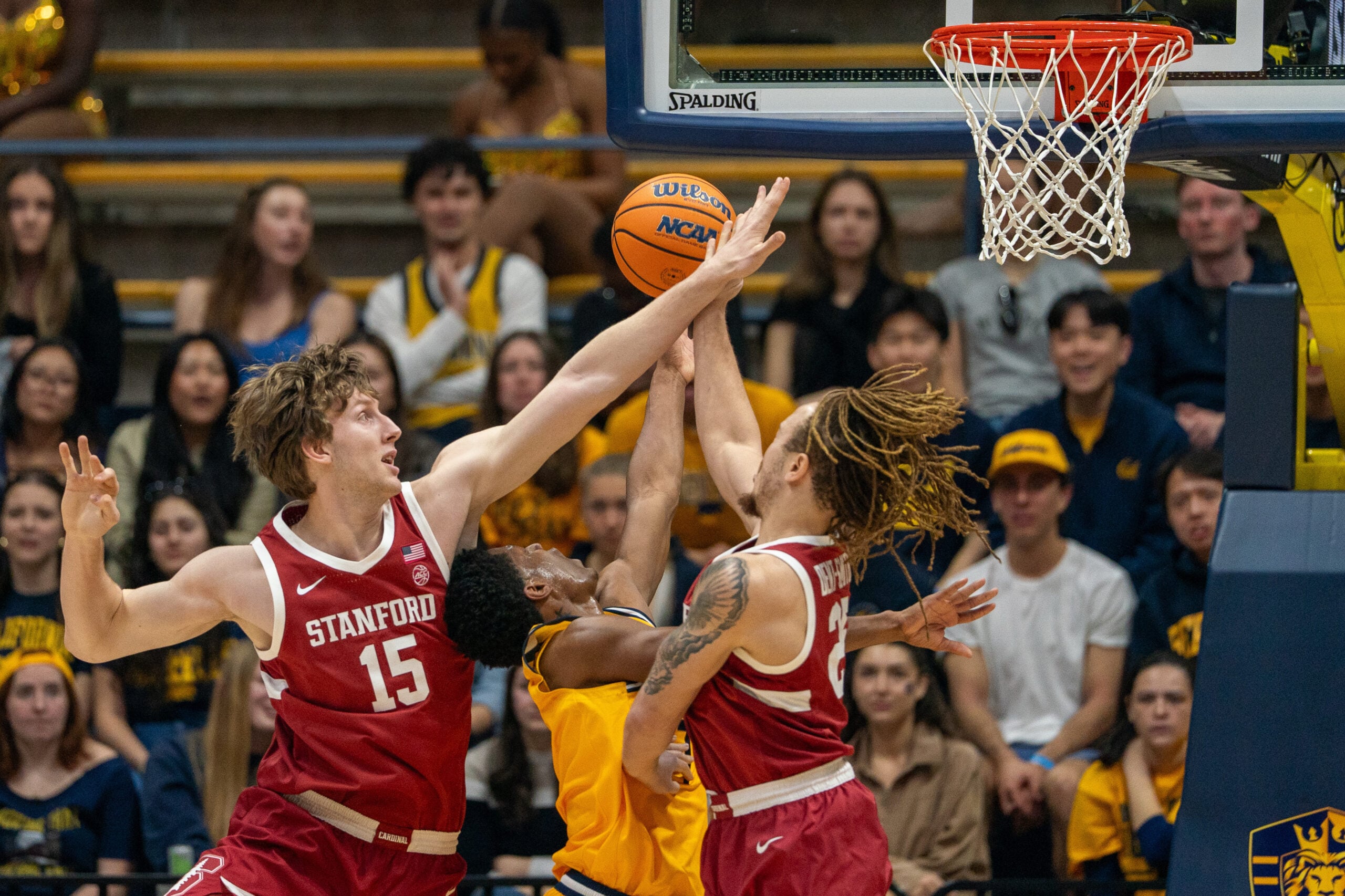 Feb 21, 2026; Berkeley, California, USA; California Golden Bears guard Dai Dai Ames (7) shoots a layup against Stanford Cardinal forward Oskar Giltay (15) and Stanford Cardinal guard Jeremy Dent-Smith (25) during the first half at Haas Pavilion. Mandatory Credit: Neville E. Guard-Imagn Images