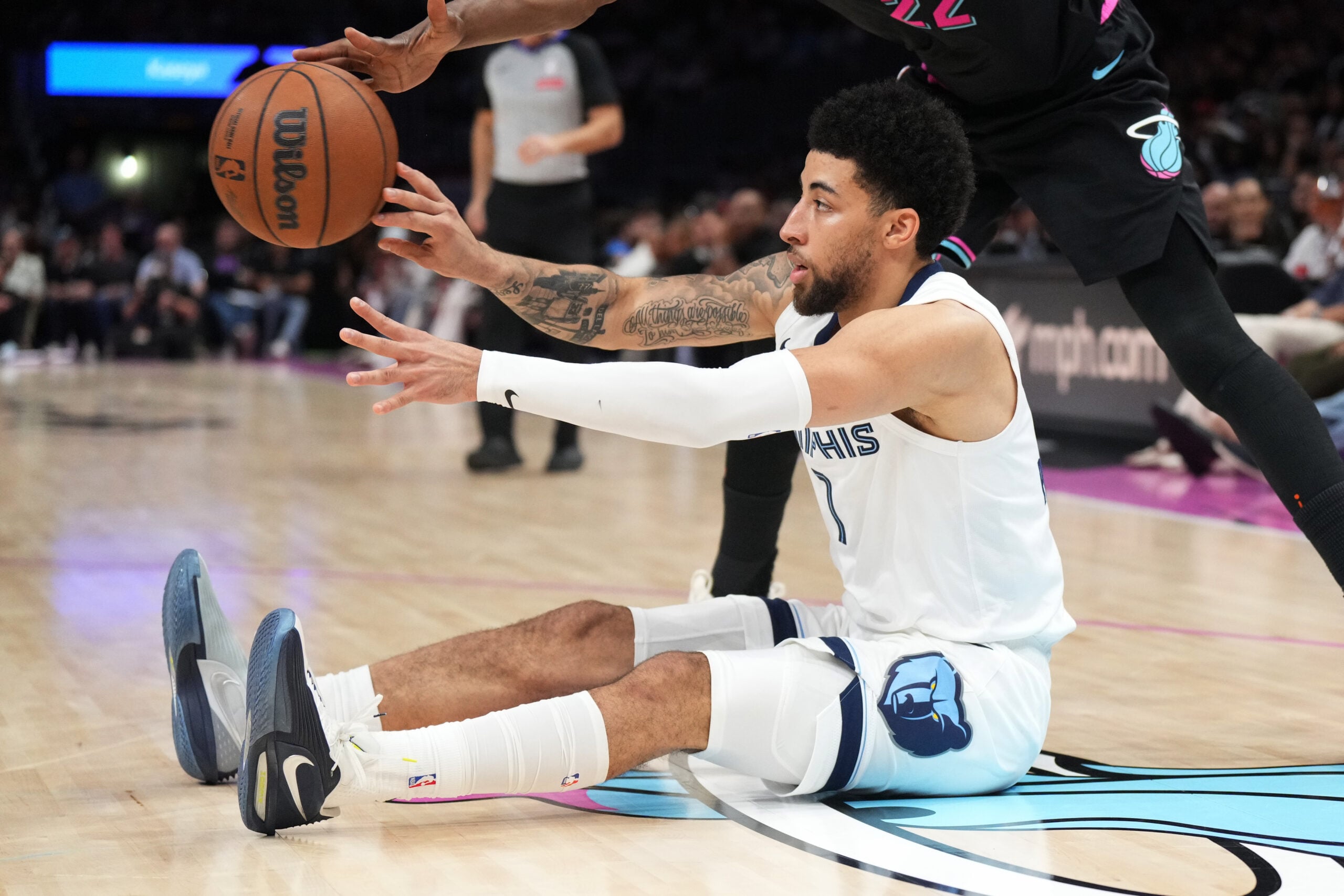 Feb 21, 2026; Miami, Florida, USA; Memphis Grizzlies guard Scotty Pippen Jr. (1) passes the ball after scrambling for possession during the second half against the Miami Heat at Kaseya Center. Mandatory Credit: Jim Rassol-Imagn Images
