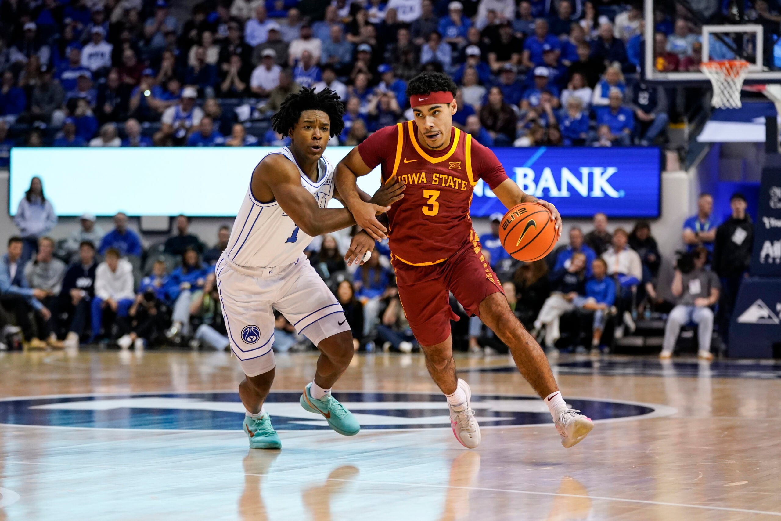Feb 21, 2026; Provo, Utah, USA; Iowa State Cyclones guard Tamin Lipsey (3) controls the ball while being defended by BYU Cougars guard Robert Wright III (1) during the second half at Marriott Center. Mandatory Credit: Aaron Baker-Imagn Images