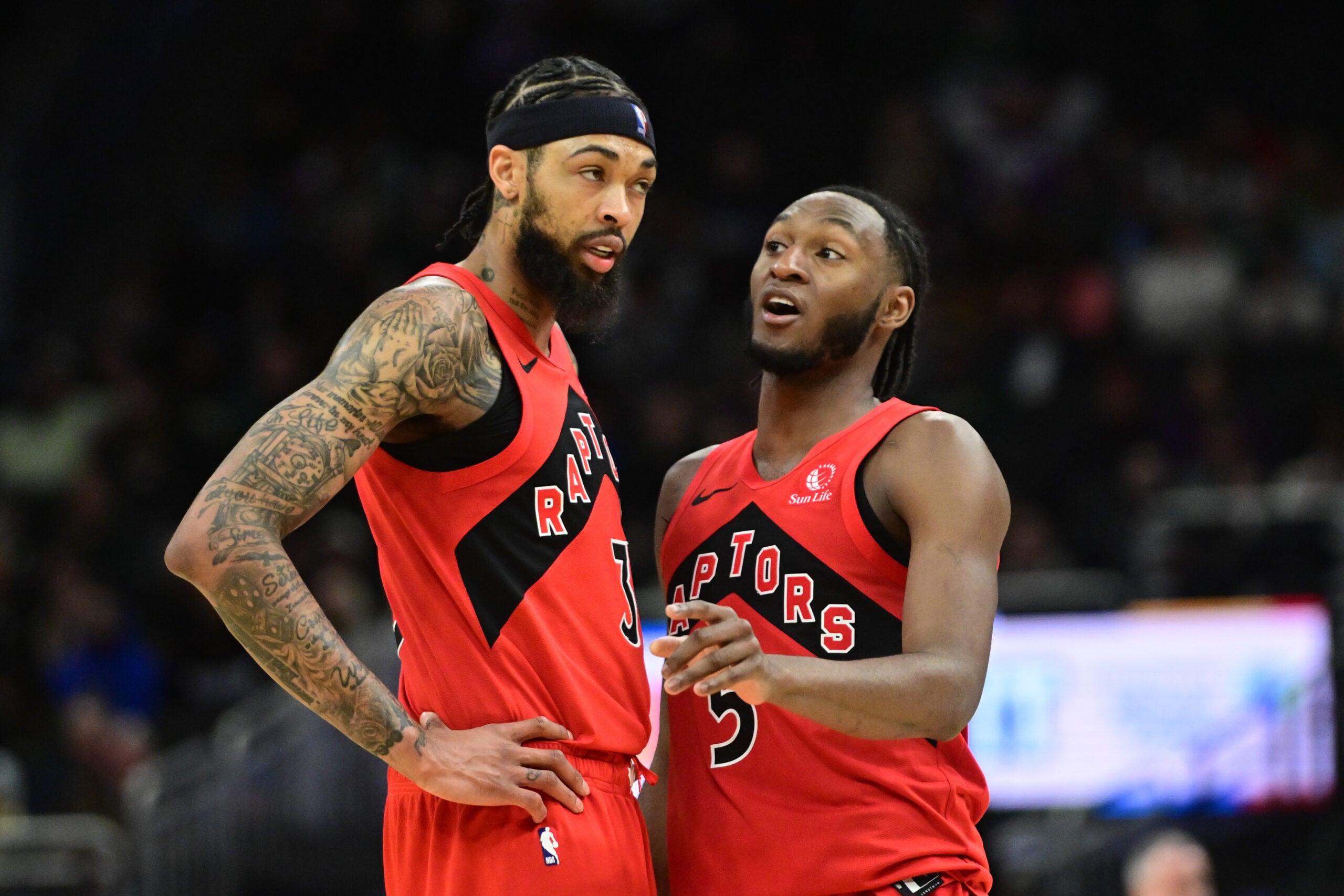 Feb 22, 2026; Milwaukee, Wisconsin, USA; Toronto Raptors guard Immanuel Quickley (5) talks to forward Brandon Ingram (3) in the second quarter against the Milwaukee Bucks at Fiserv Forum. Mandatory Credit: Benny Sieu-Imagn Images