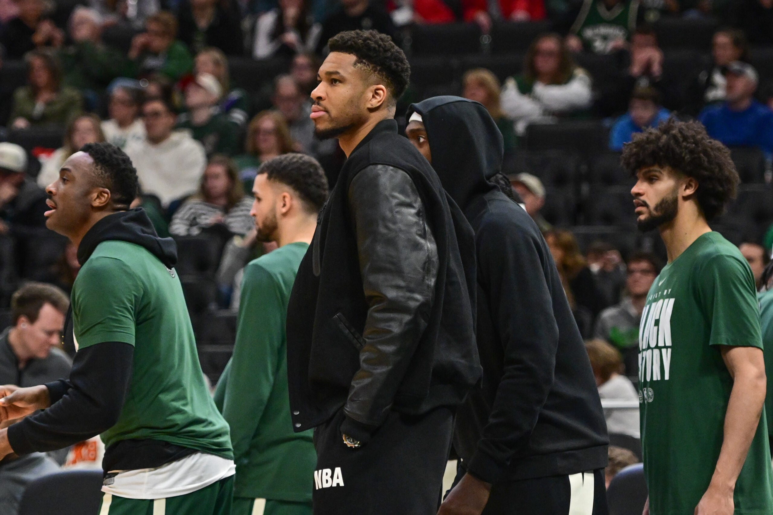 Feb 22, 2026; Milwaukee, Wisconsin, USA; Milwaukee Bucks forward Giannis Antetokounmpo (34) looks on from the bench in the second quarter against the Toronto Raptors as he recovers from a calf injury at Fiserv Forum. Mandatory Credit: Benny Sieu-Imagn Images