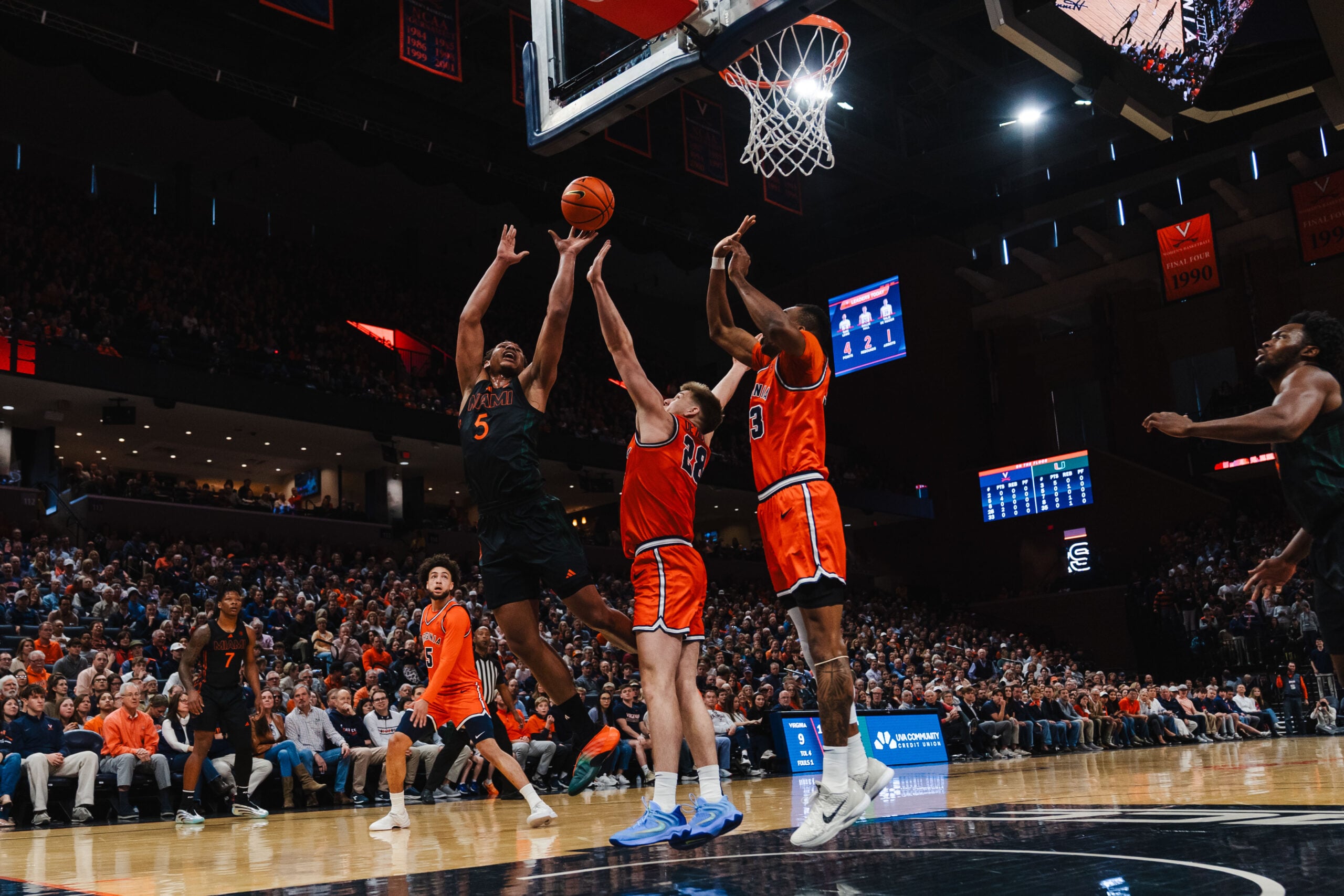 Feb 21, 2026; Charlottesville, Virginia, USA; Miami (FL) Hurricanes forward Malik Reneau (5) shoots the ball while Virginia Cavaliers forward Thijs de Ridder (28) defends during the first half at John Paul Jones Arena. Mandatory Credit: Emily Faith Morgan-Imagn Images