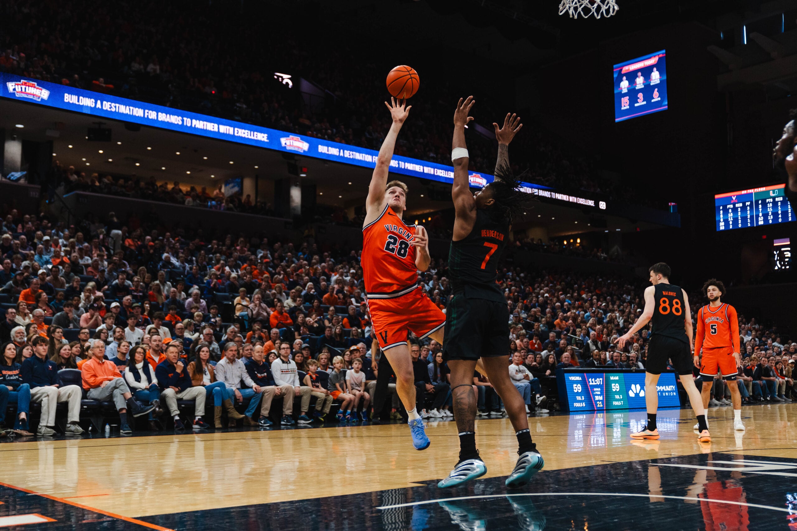 Feb 21, 2026; Charlottesville, Virginia, USA; Virginia Cavaliers forward Thijs de Ridder (28) shoots the ball over Miami (FL) Hurricanes forward Shelton Henderson (7) during the second half at John Paul Jones Arena. Mandatory Credit: Emily Faith Morgan-Imagn Images