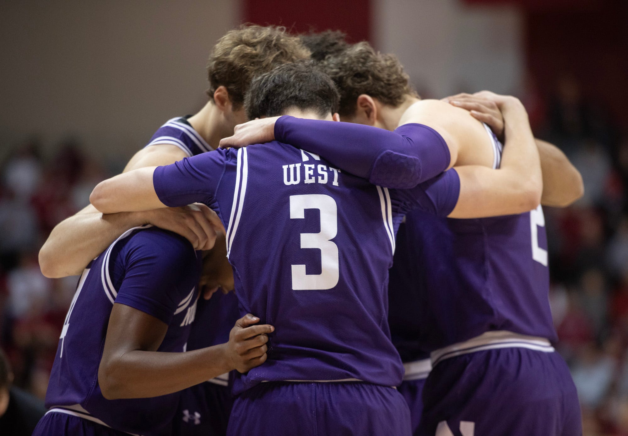 Northwestern's Jake West (3) and the Wildcats huddle up during the Indiana versus Northwestern men's basketball game at Simon Skjodt Assembly Hall on Tuesday, Feb. 24, 2026.