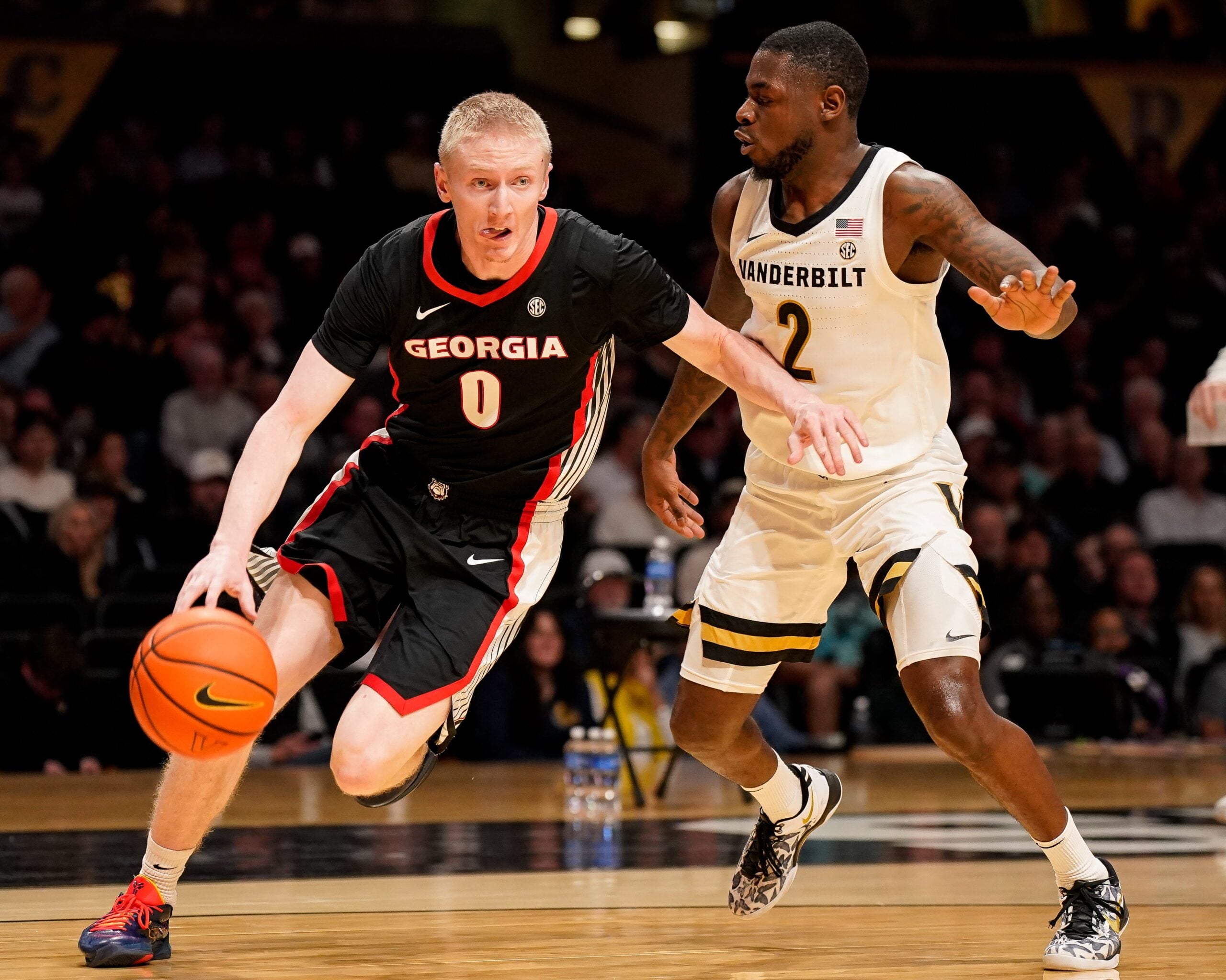 Georgia guard Blue Cain (0) bolts apst Vanderbilt guard Duke Miles (2) during the first half at Memorial Gym in Nashville, Tenn., Wednesday, Feb. 25, 2026.