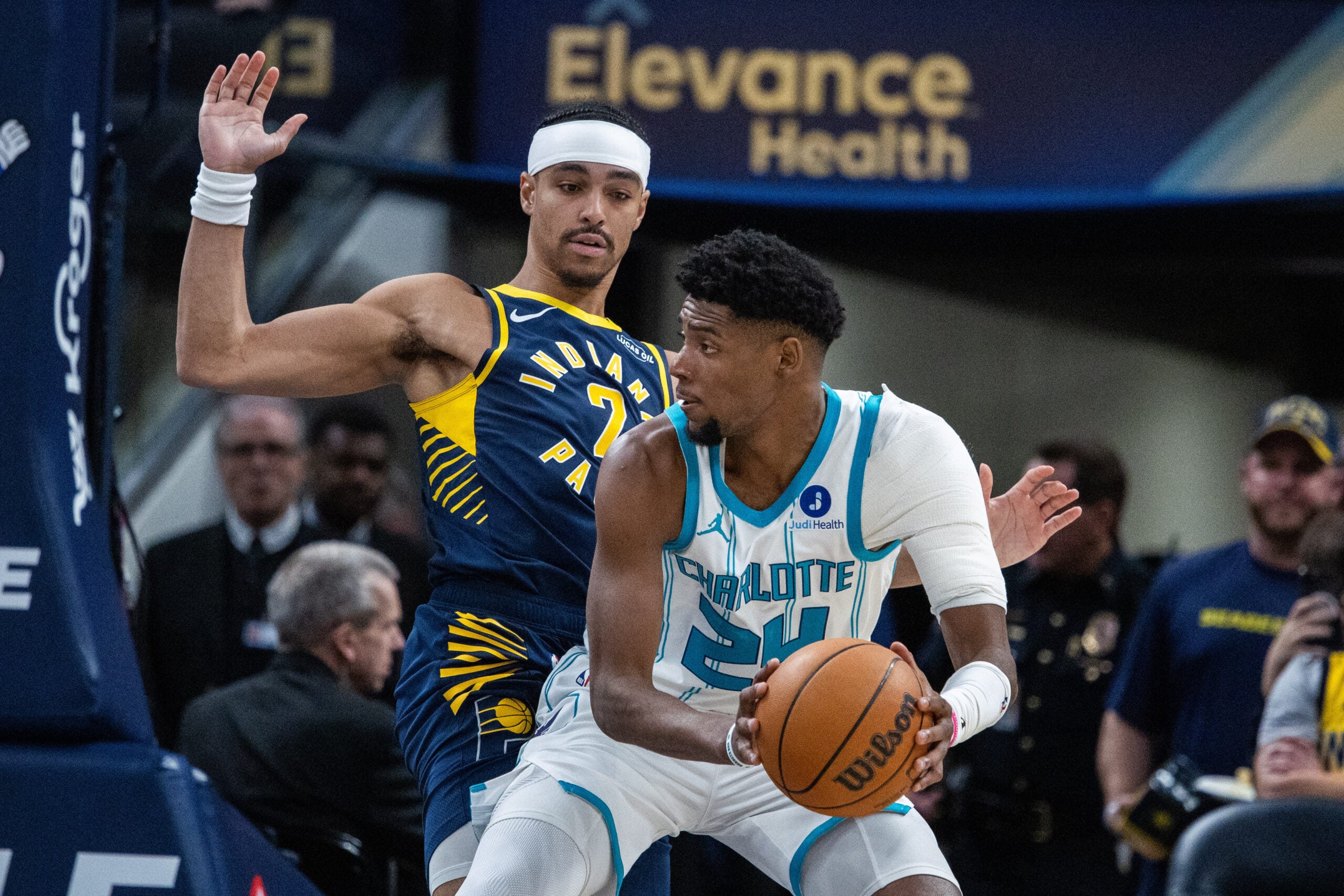 Feb 26, 2026; Indianapolis, Indiana, USA; Charlotte Hornets forward Brandon Miller (24) holds the ball while Indiana Pacers guard Andrew Nembhard (2) defends in the first half at Gainbridge Fieldhouse. Mandatory Credit: Trevor Ruszkowski-Imagn Images