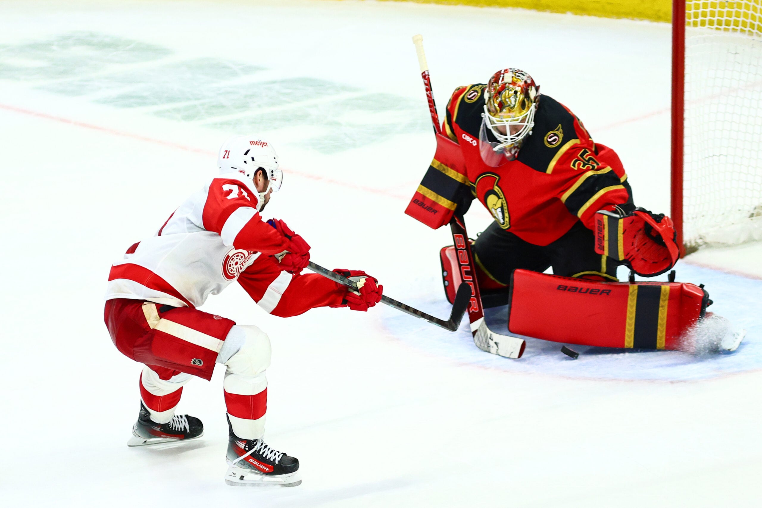 Feb 26, 2026; Ottawa, Ontario, CAN; Detroit Red Wings center Dylan Larkin (71) scores on Ottawa Senators goaltender Linus Ullmark (35) during overtime at Canadian Tire Centre. Mandatory Credit: Keito Newman-Imagn Images