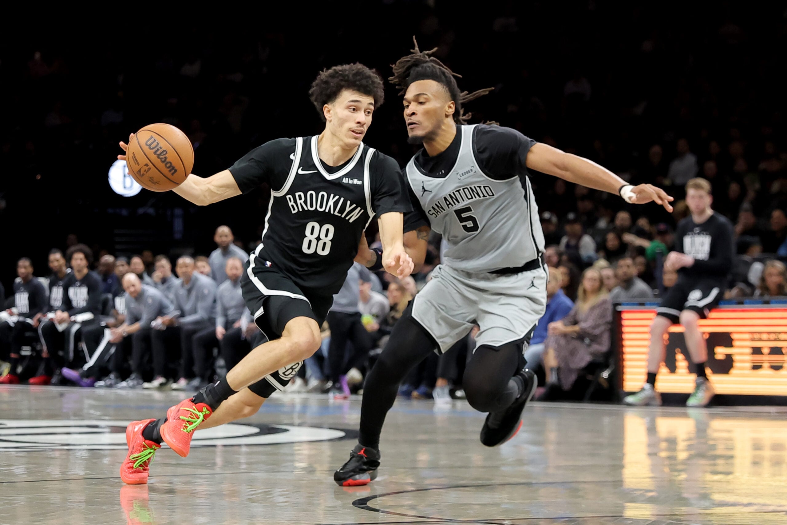 Feb 26, 2026; Brooklyn, New York, USA; Brooklyn Nets guard Nolan Traore (88) drives to the basket against San Antonio Spurs guard Stephon Castle (5) during the third quarter at Barclays Center. Mandatory Credit: Brad Penner-Imagn Images