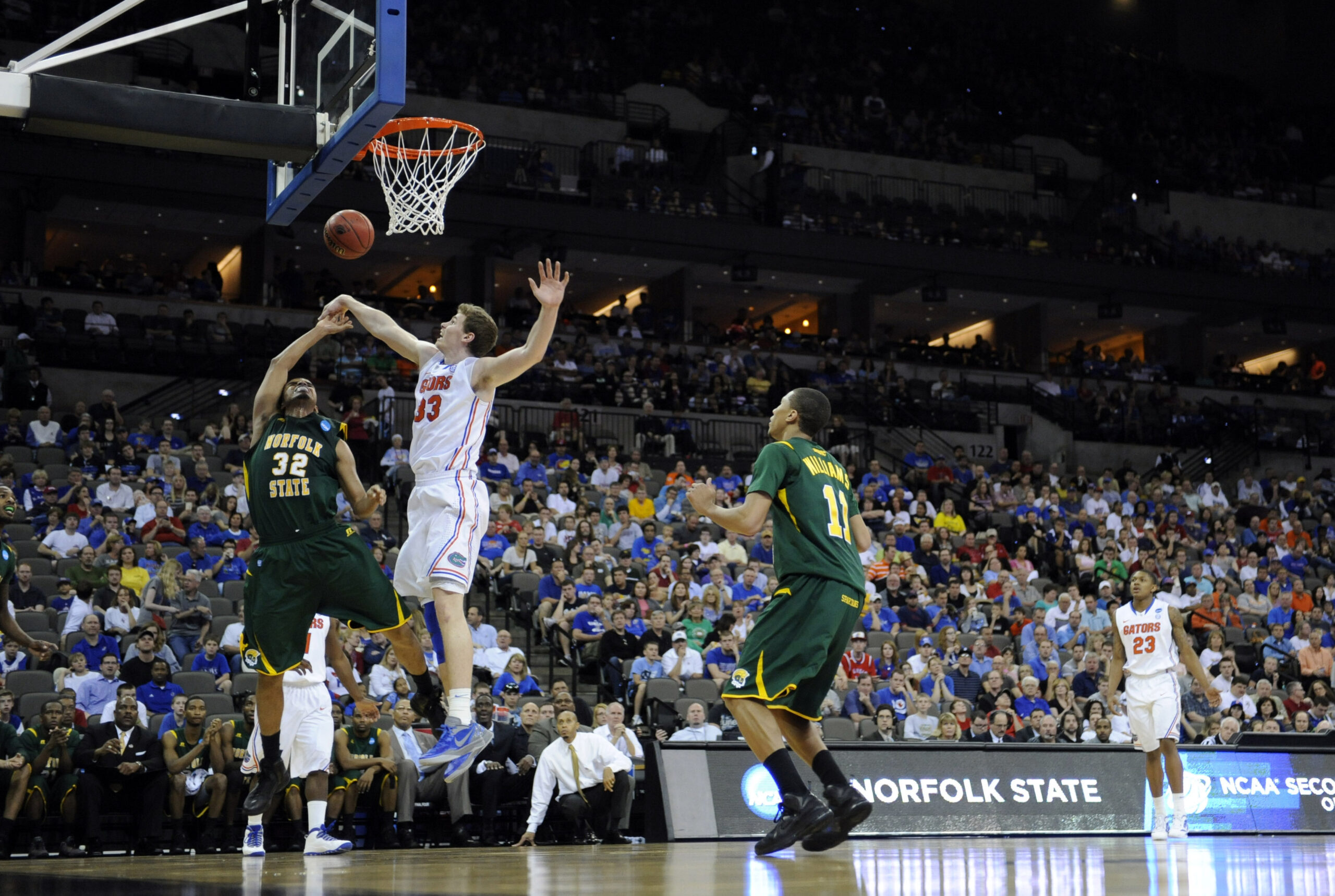 Mar 18, 2012; Omaha, NE, USA; Florida Gators forward Erik Murphy (33) blocks the shot of Norfolk State Spartans forward Marcos Tamares (32) during the second half in the third round of the 2012 NCAA men's basketball tournament at the CenturyLink Center. Florida defeated Norfolk State 84-50. Mandatory Credit: Peter G. Aiken-Imagn Images