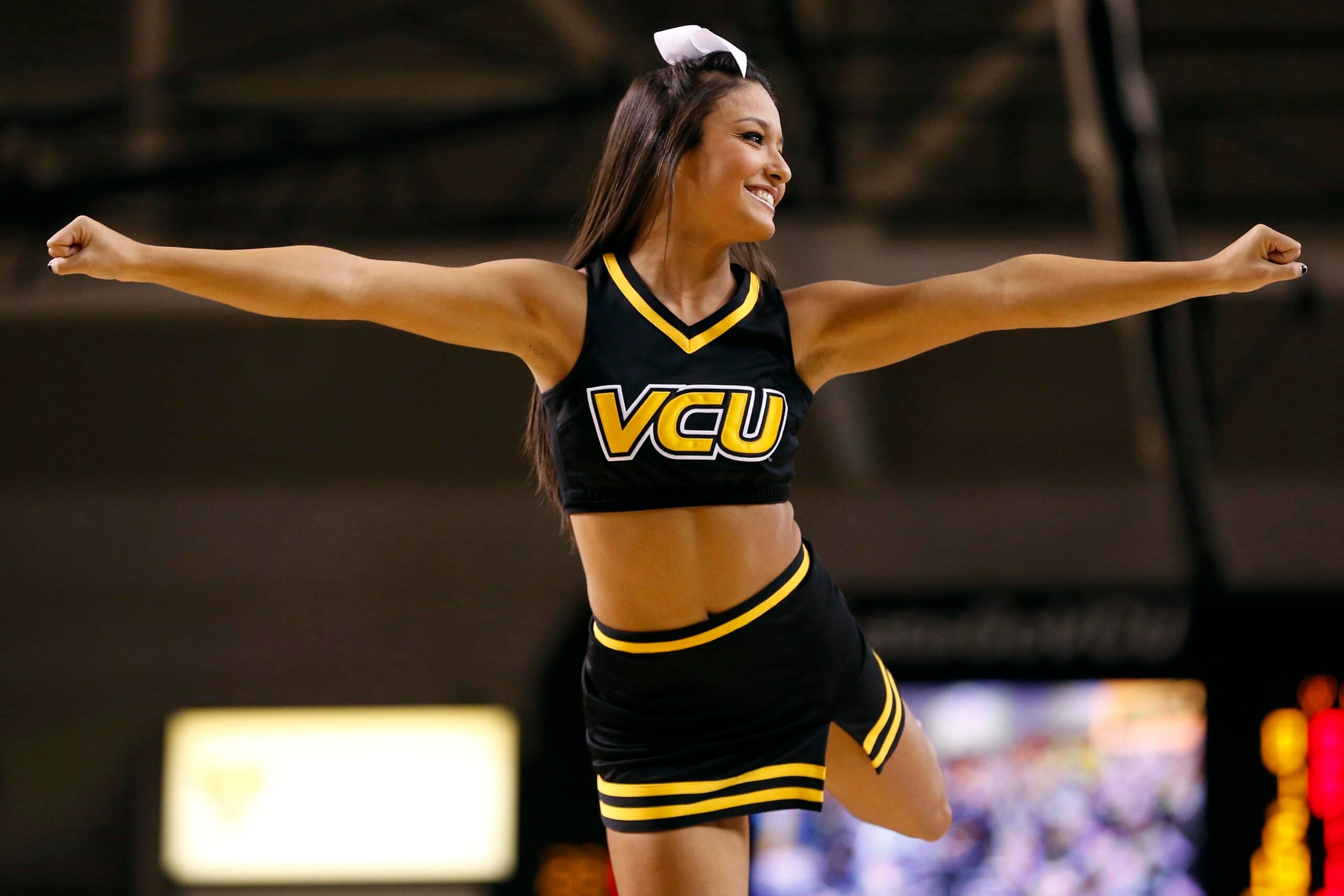 Jan 29, 2014; Richmond, VA, USA; A Virginia Commonwealth Rams cheerleader cheers during a stoppage in play against the Fordham Rams in the first half at Stuart C. Siegel Center. The Rams won 76-60. Mandatory Credit: Geoff Burke-Imagn Images